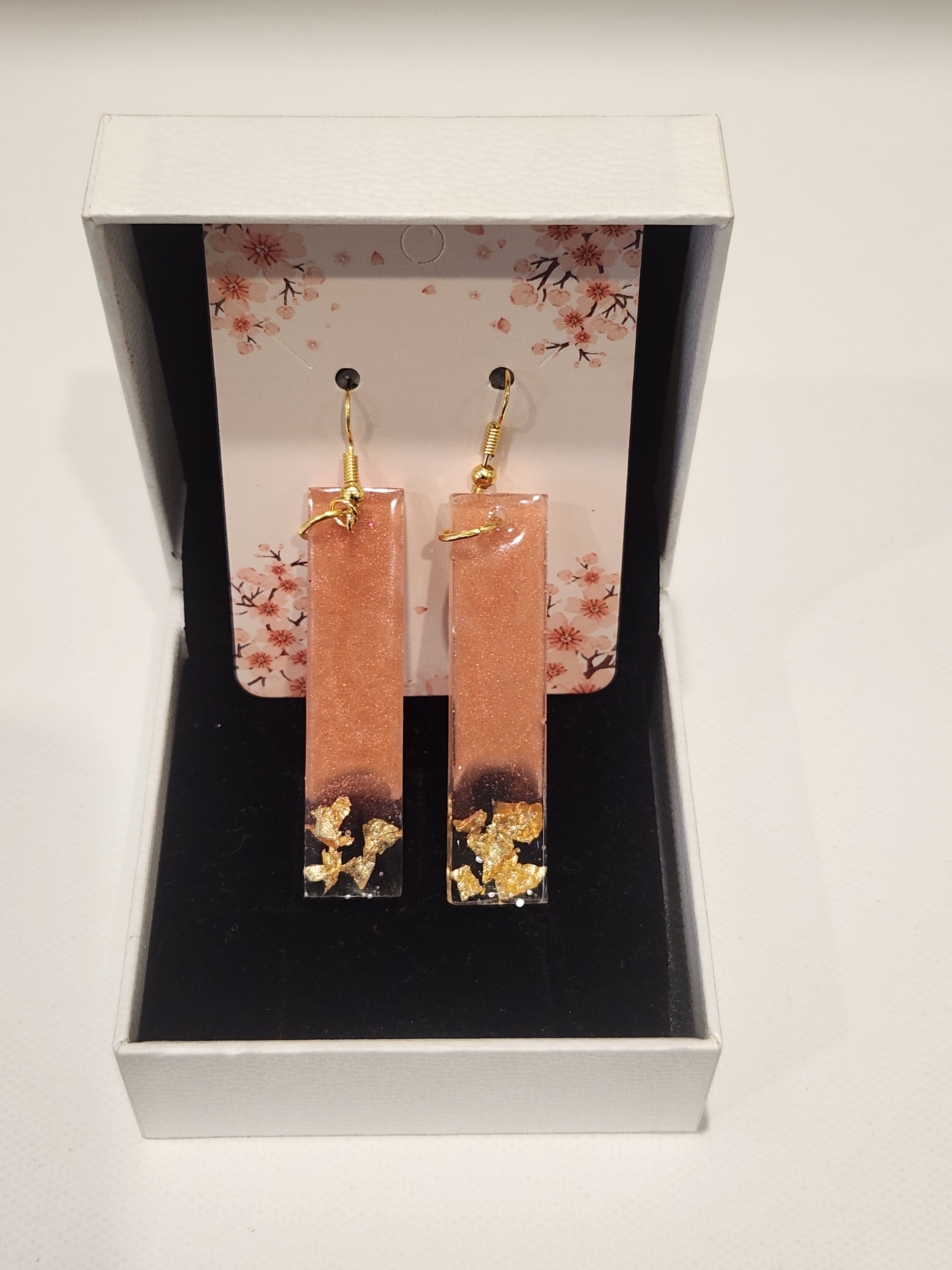 Drop earrings with metallic accents