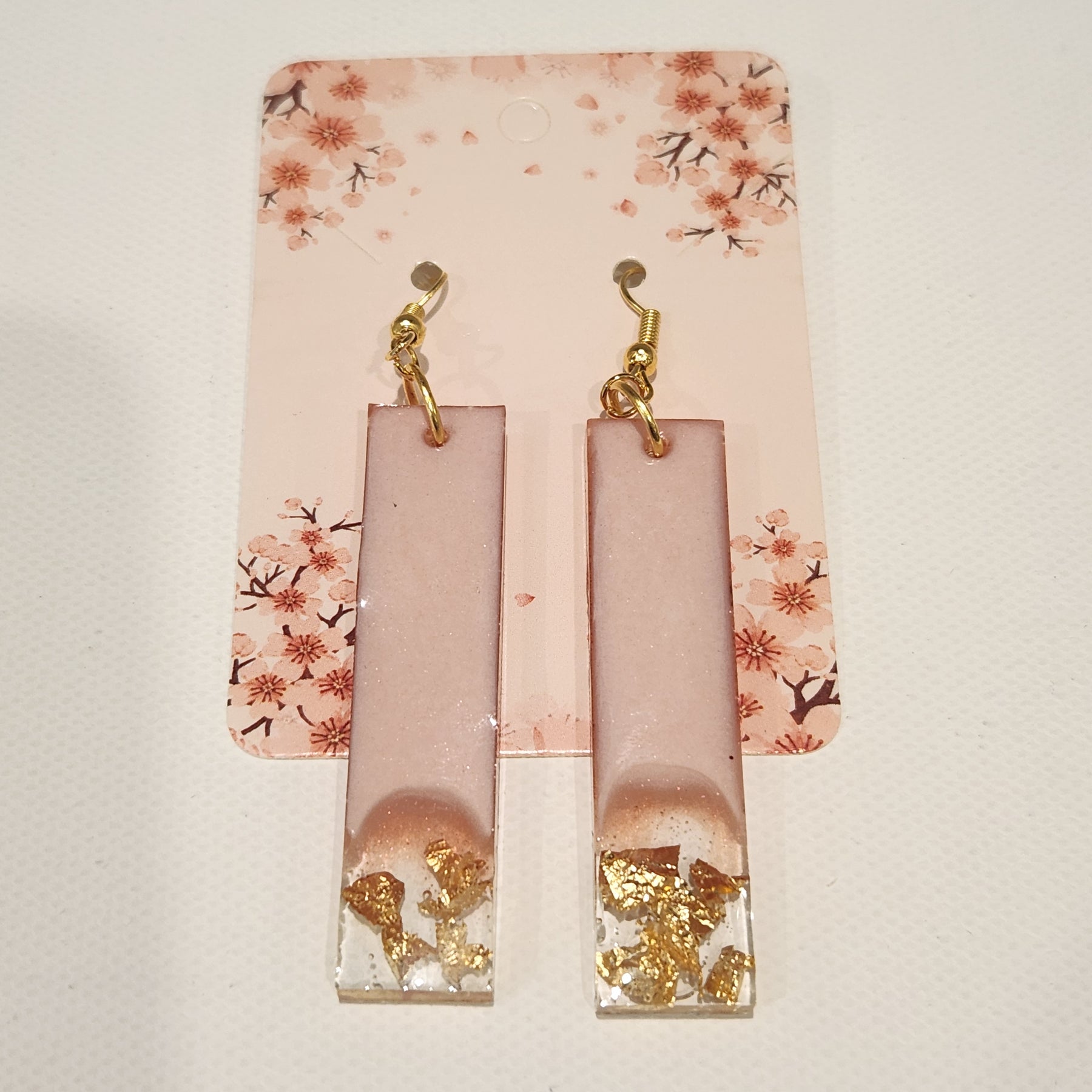 Drop earrings with metallic accents