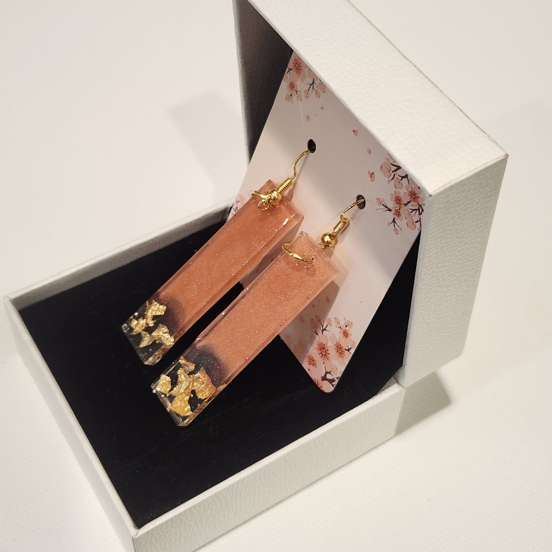 Drop earrings with metallic accents