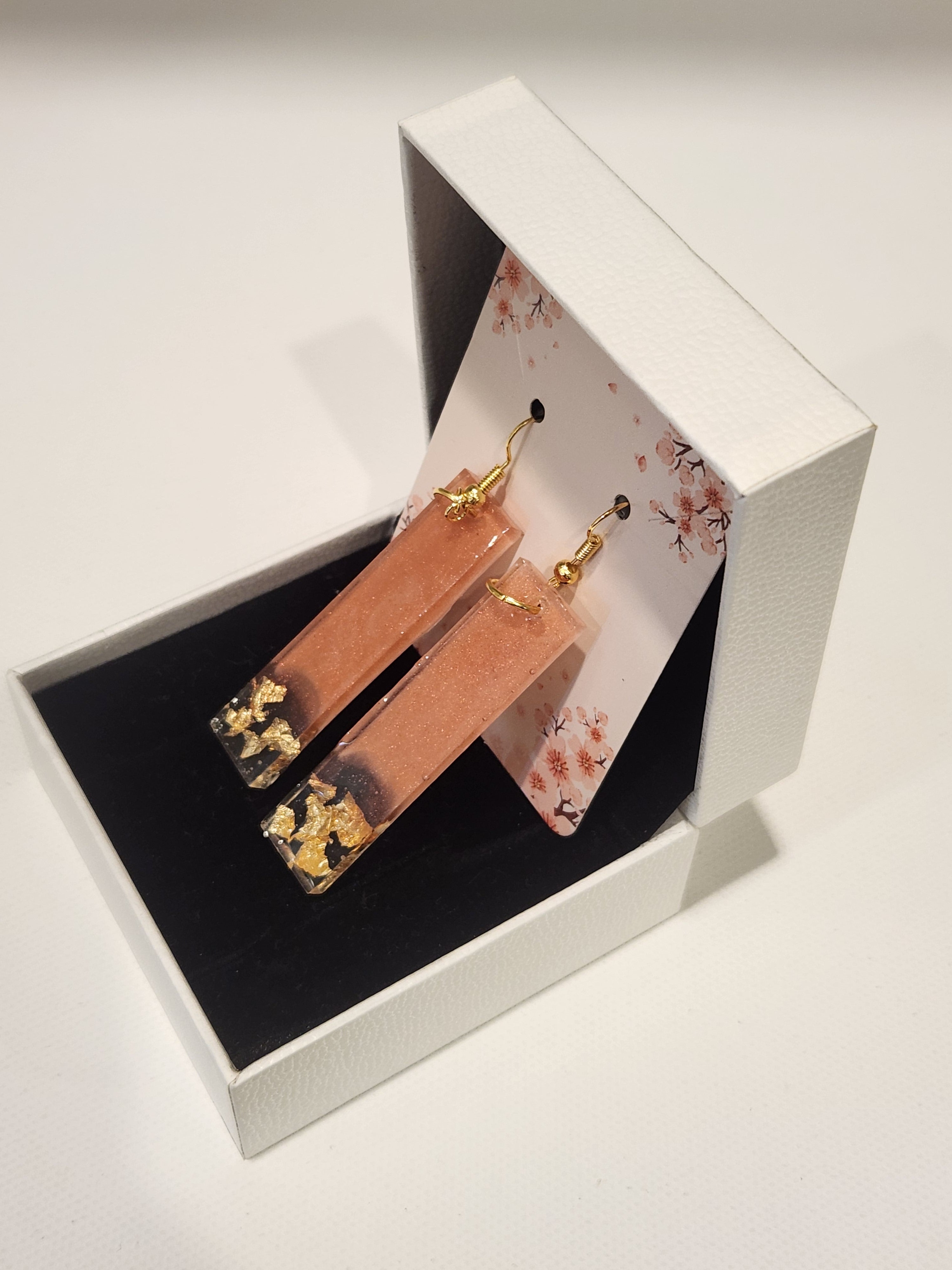 Drop earrings with metallic accents
