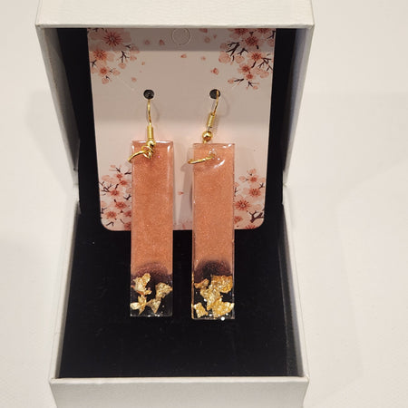 Drop earrings with metallic accents