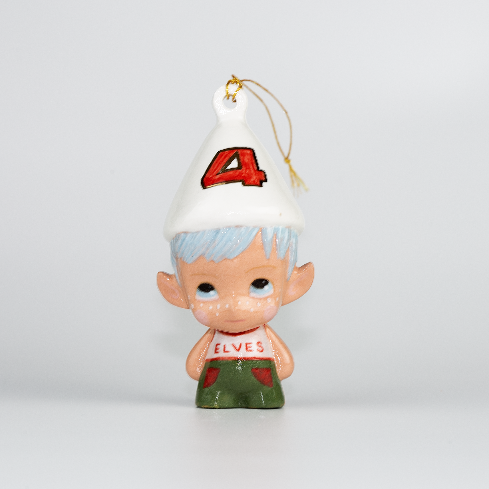 Handmade Porcelain Christmas ornament. One-of-a-kind. Kade the footy Elf.