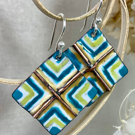 White, gold, teal and green fold form enamel earrings. Handmade