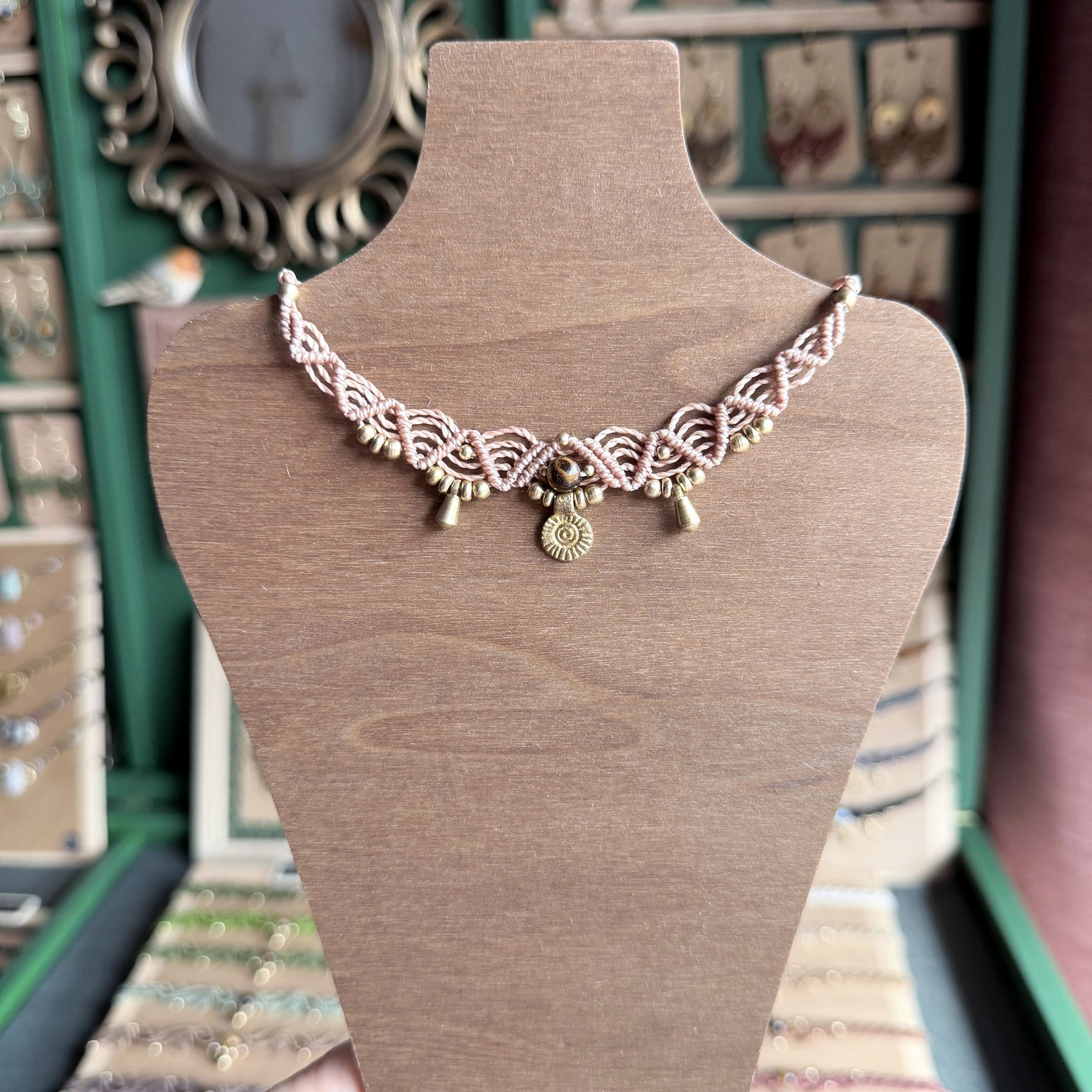 Macrame Boho Collier with gemstone bead and brass charms.