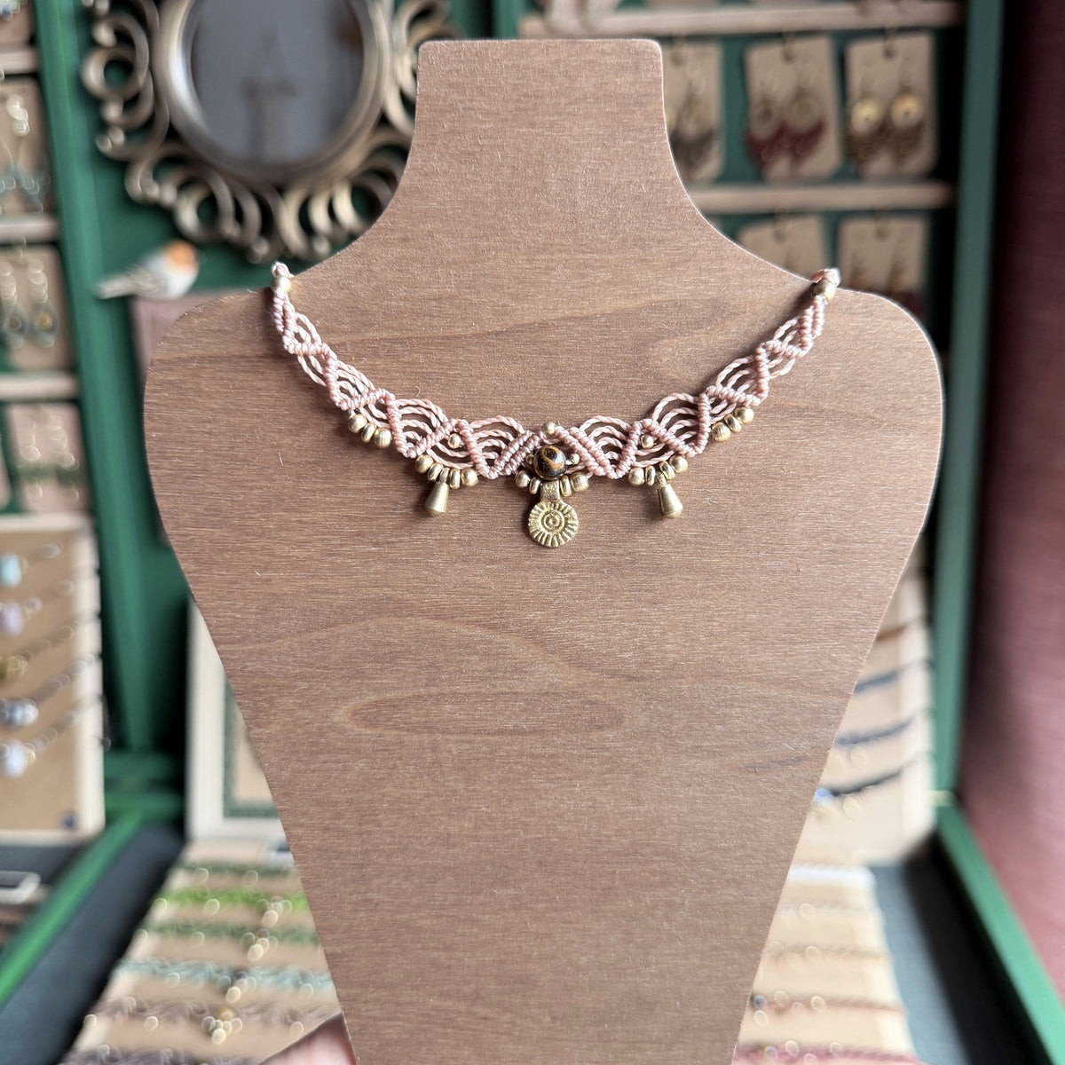 Macrame Boho Collier with gemstone bead and brass charms.
