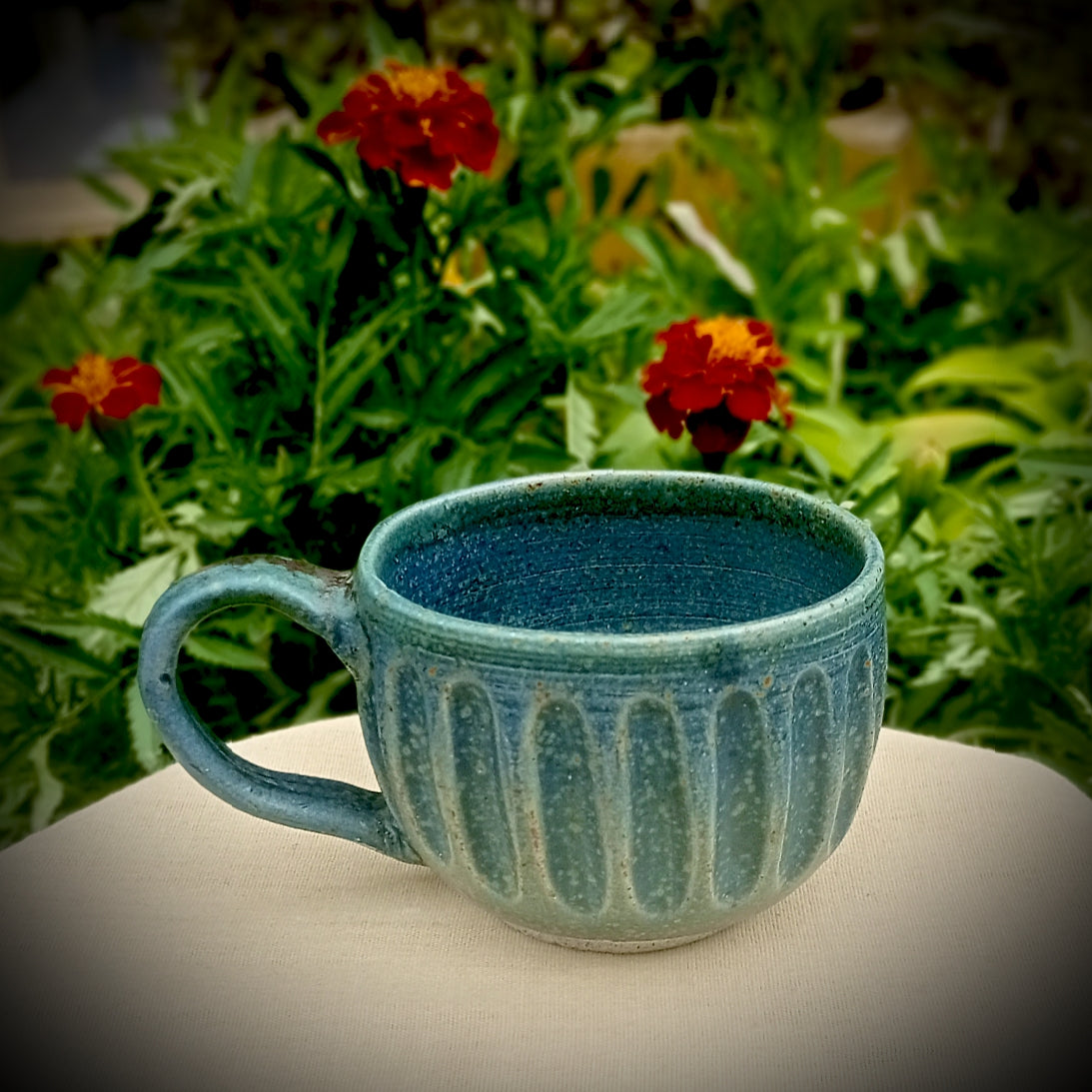 Blue Fluted cup with amber flecks