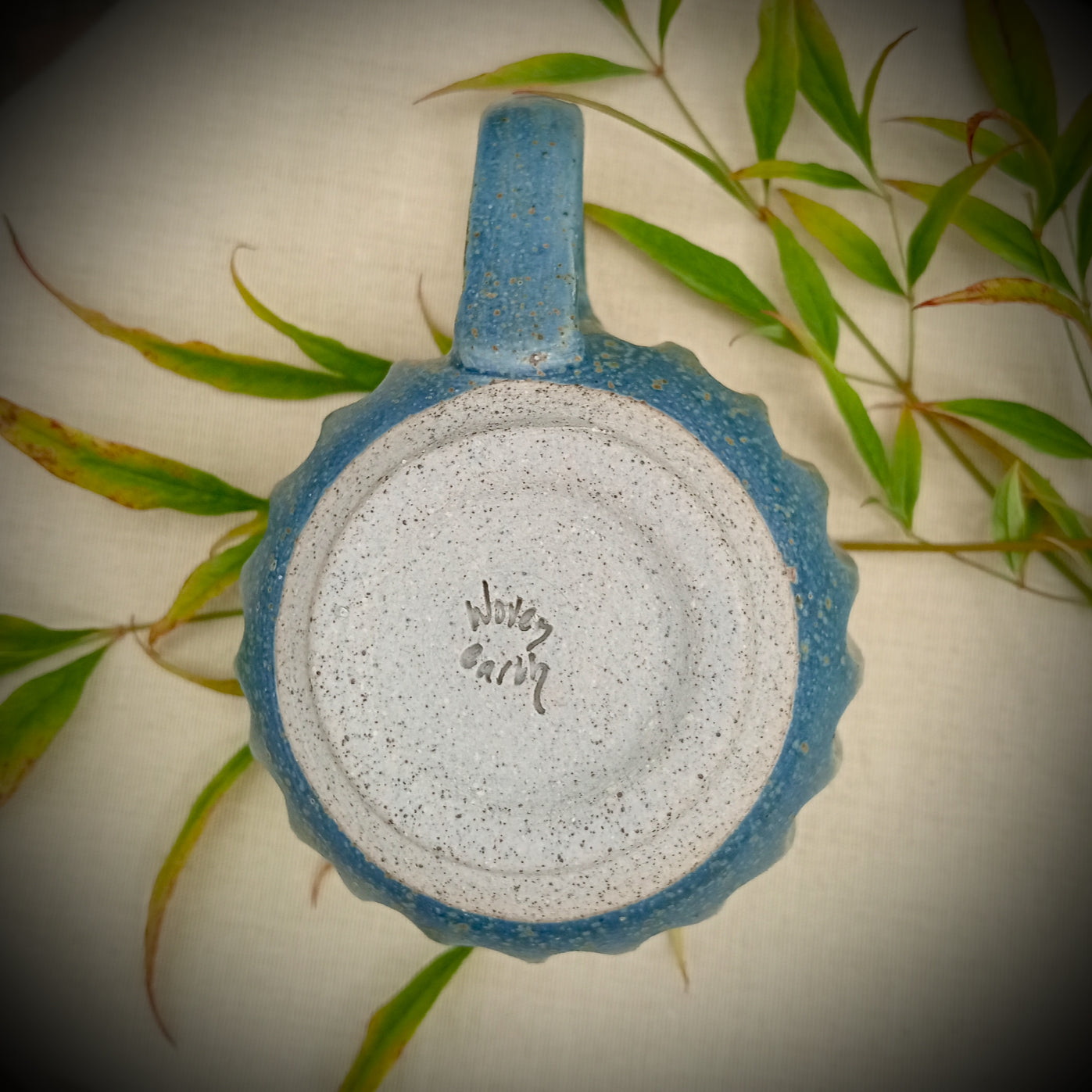 Blue Fluted cup with amber flecks