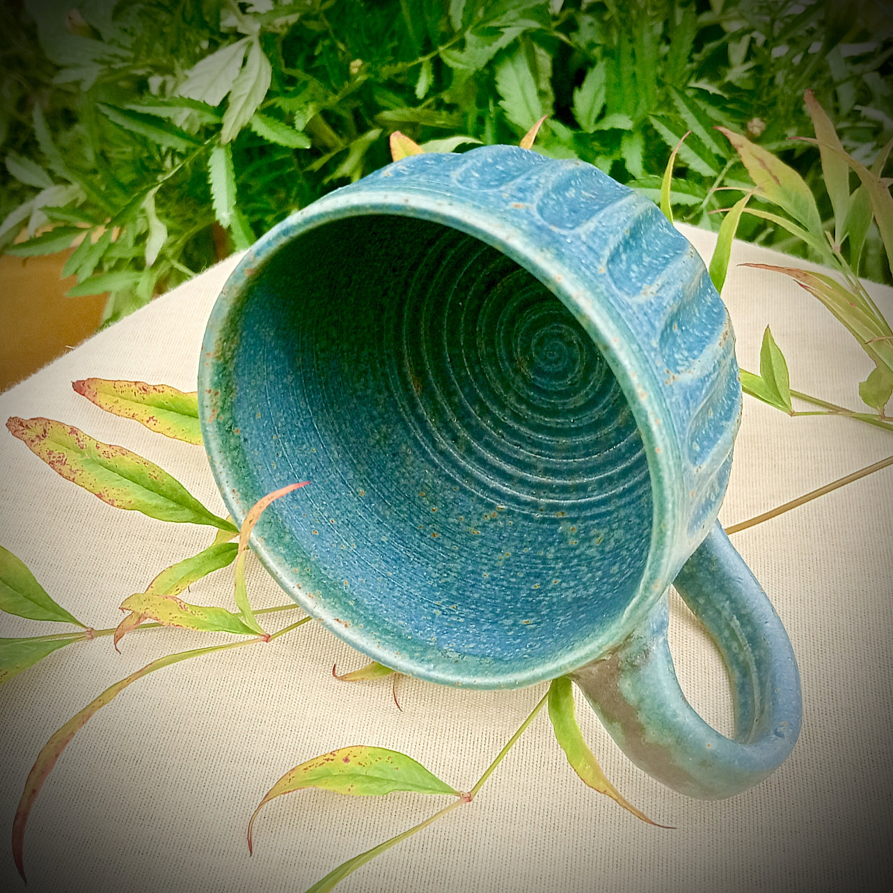 Blue Fluted cup with amber flecks