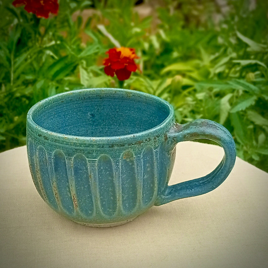 Blue Fluted cup with amber flecks
