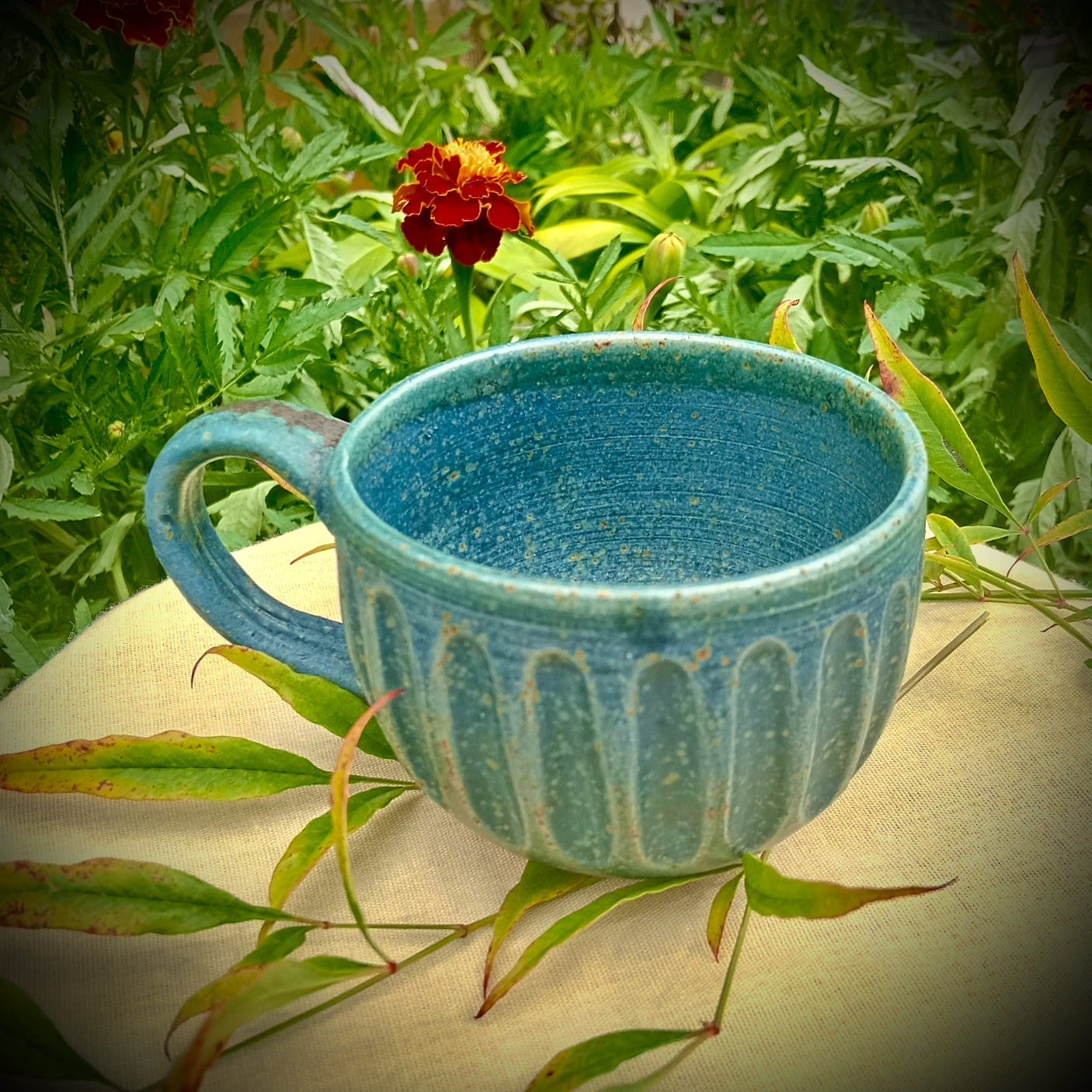 Blue Fluted cup with amber flecks