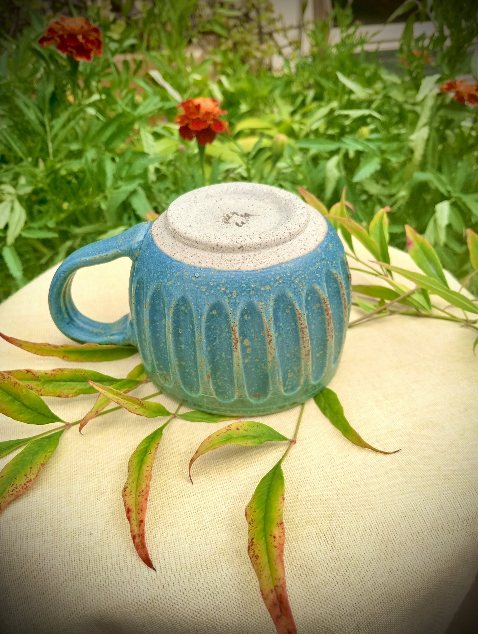 Blue Fluted cup with amber flecks