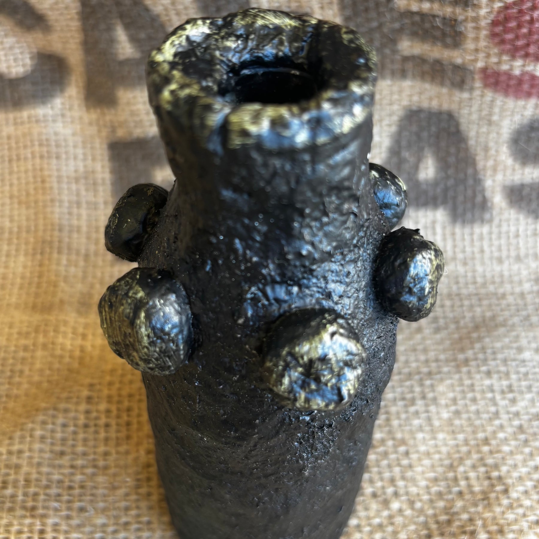 Small black and gold vase