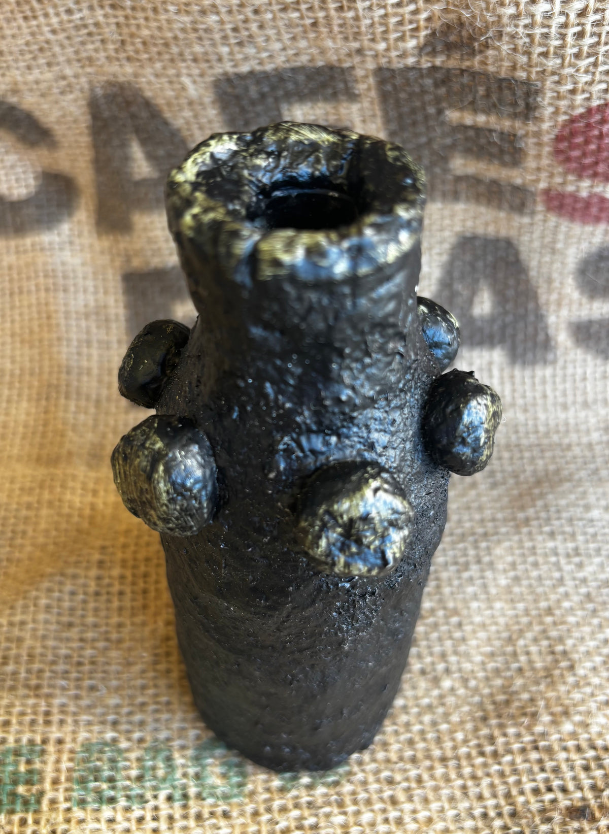 Small black and gold vase