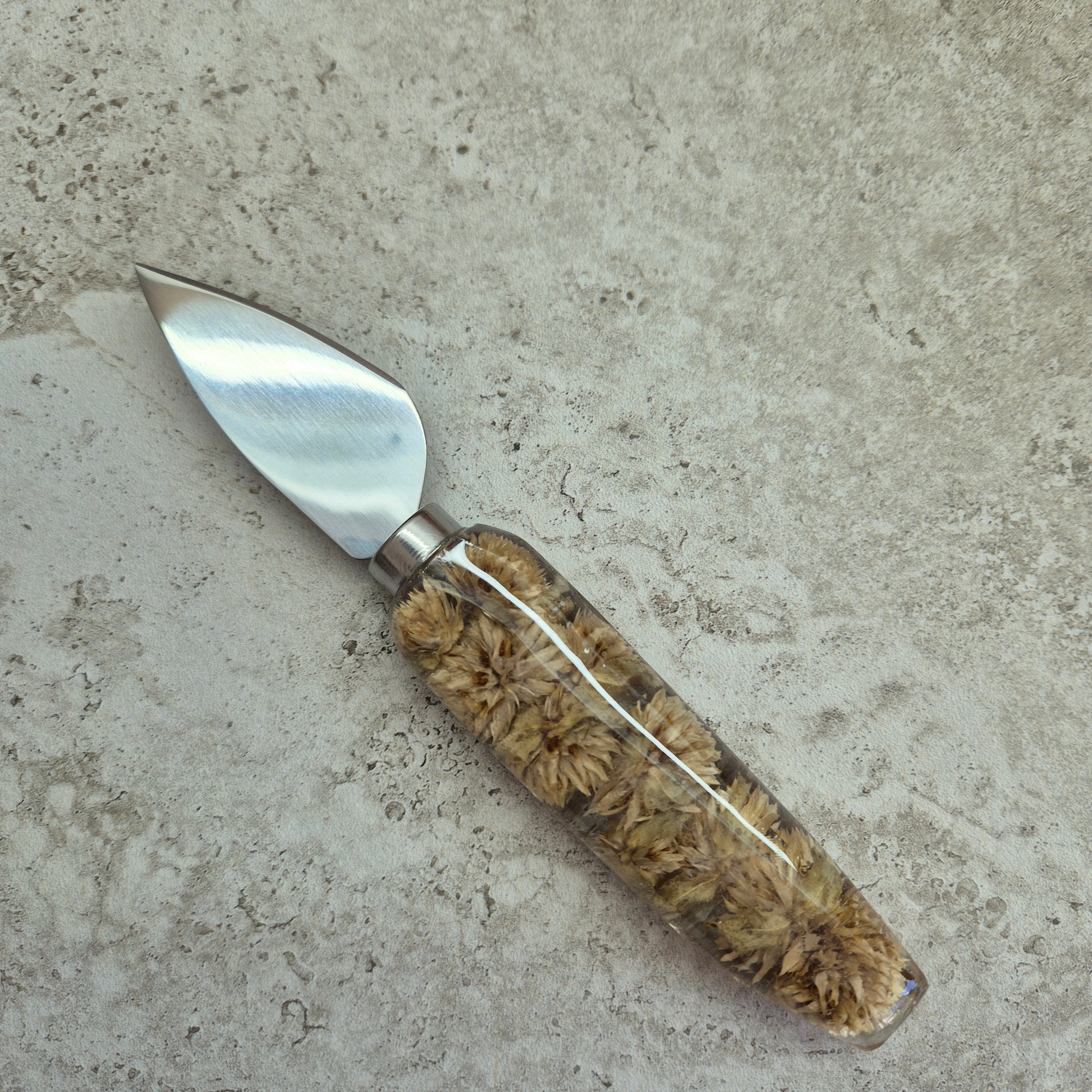 Handmade resin cheese knife with inlaid dried gomphrena flowers