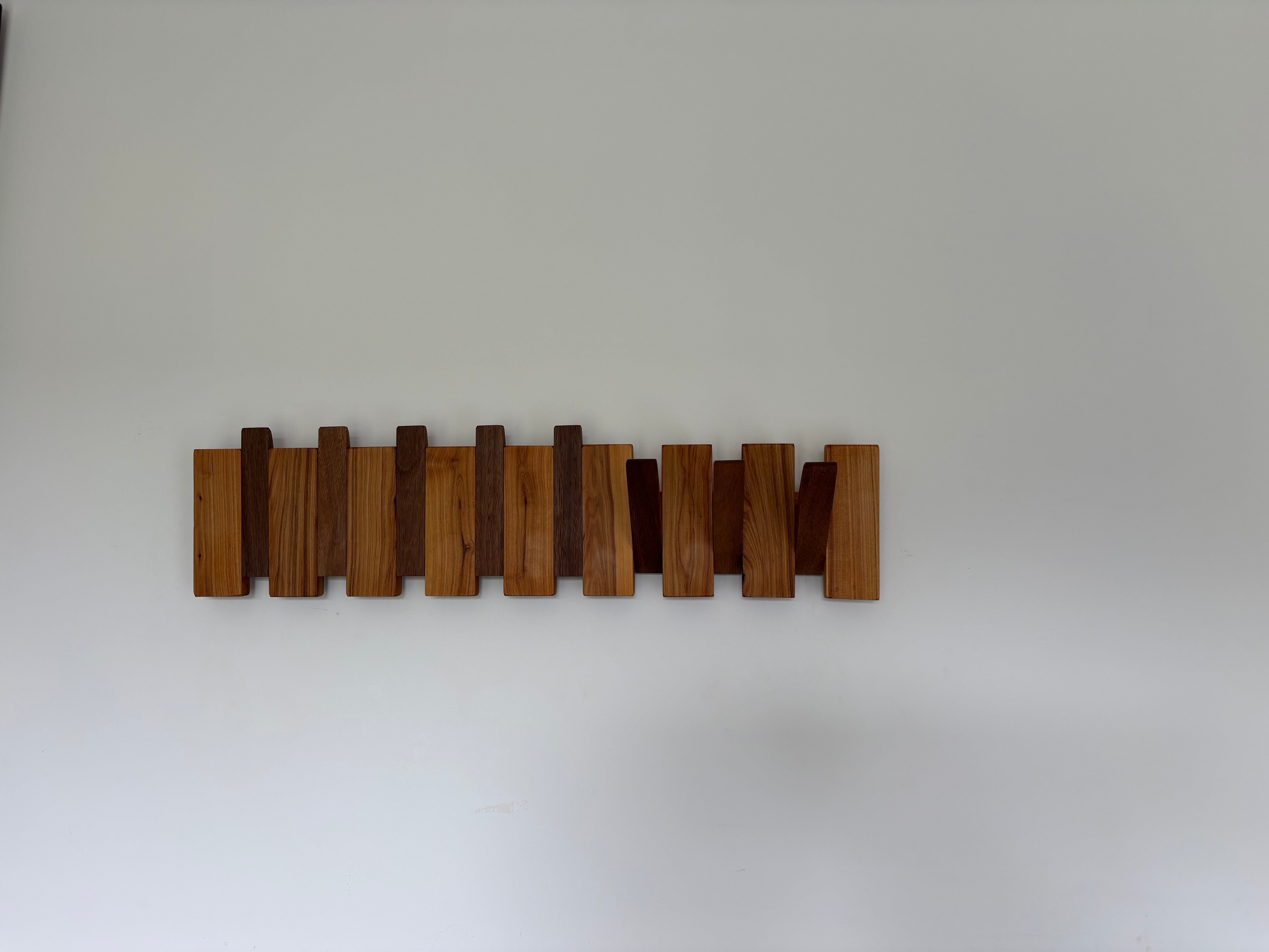 Two tone piano style coatrack