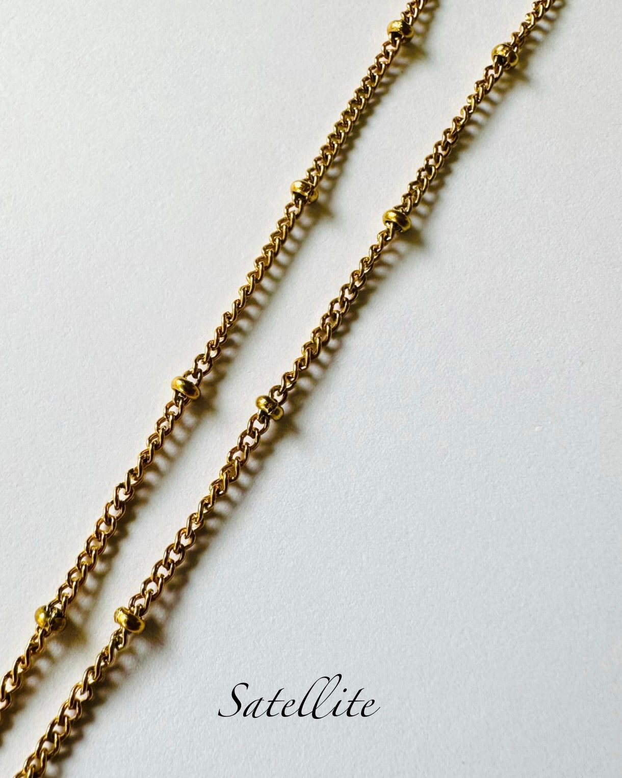 Gold plated resin necklace with purple wildflower