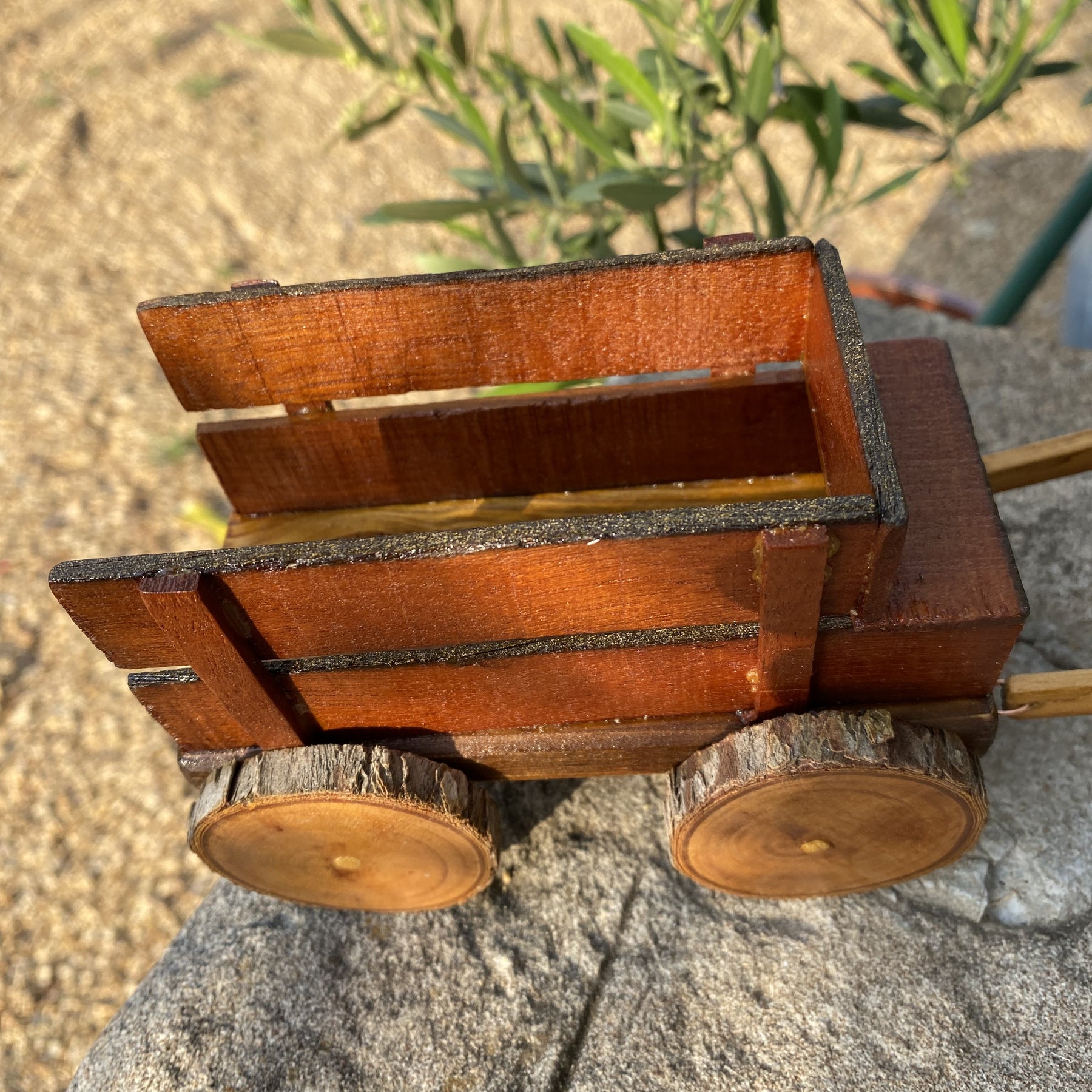 Handmade wooden cow and wagon