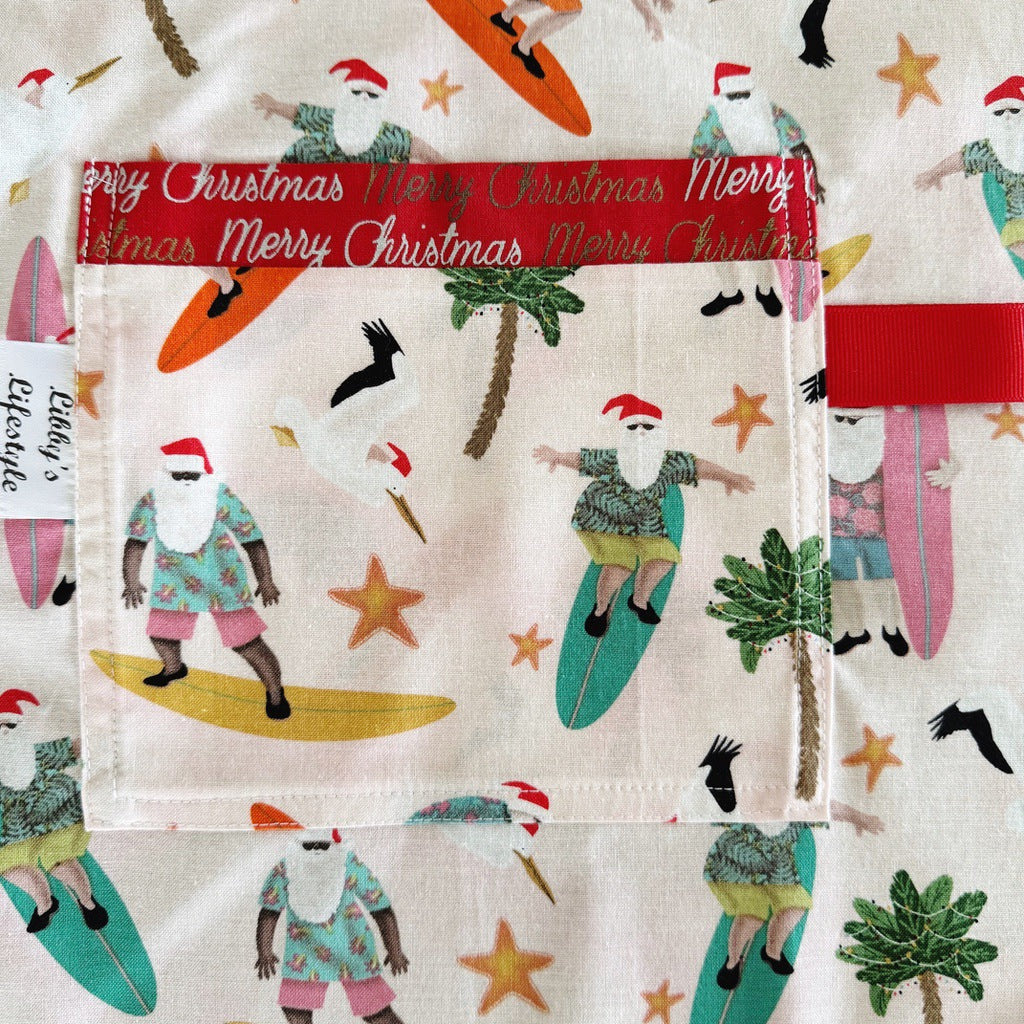 Surfing Santas. Ladies' Christmas tie back apron.