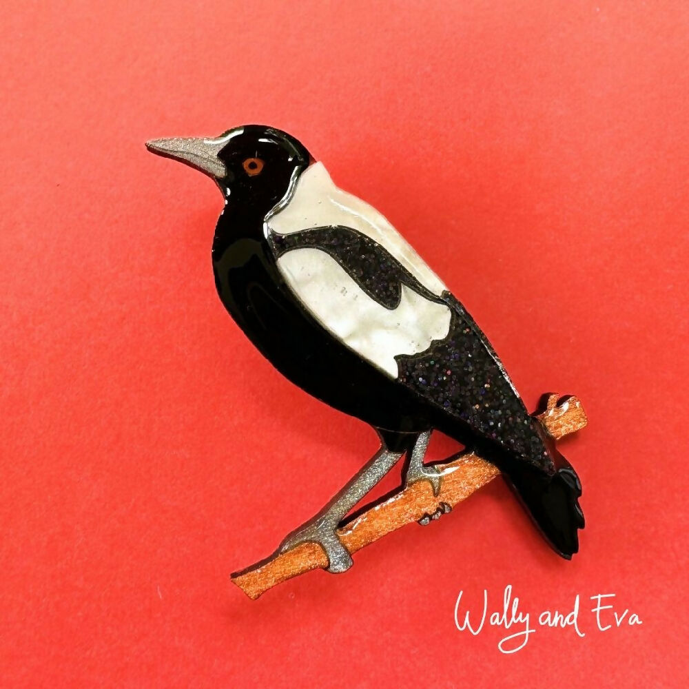 hand-painted-australian-magpie-resin-wood-brooch-on-coral