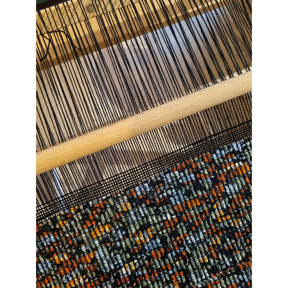 Woven black and orange floral tablerunner