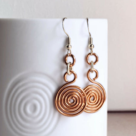 Copper and silver spiral two-tone dangle earrings