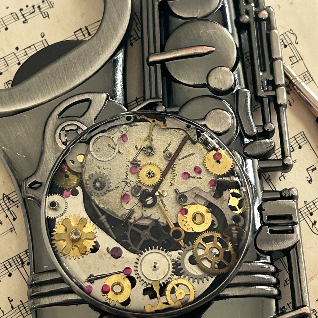 Steampunk watch parts bottle opener (Saxophone)