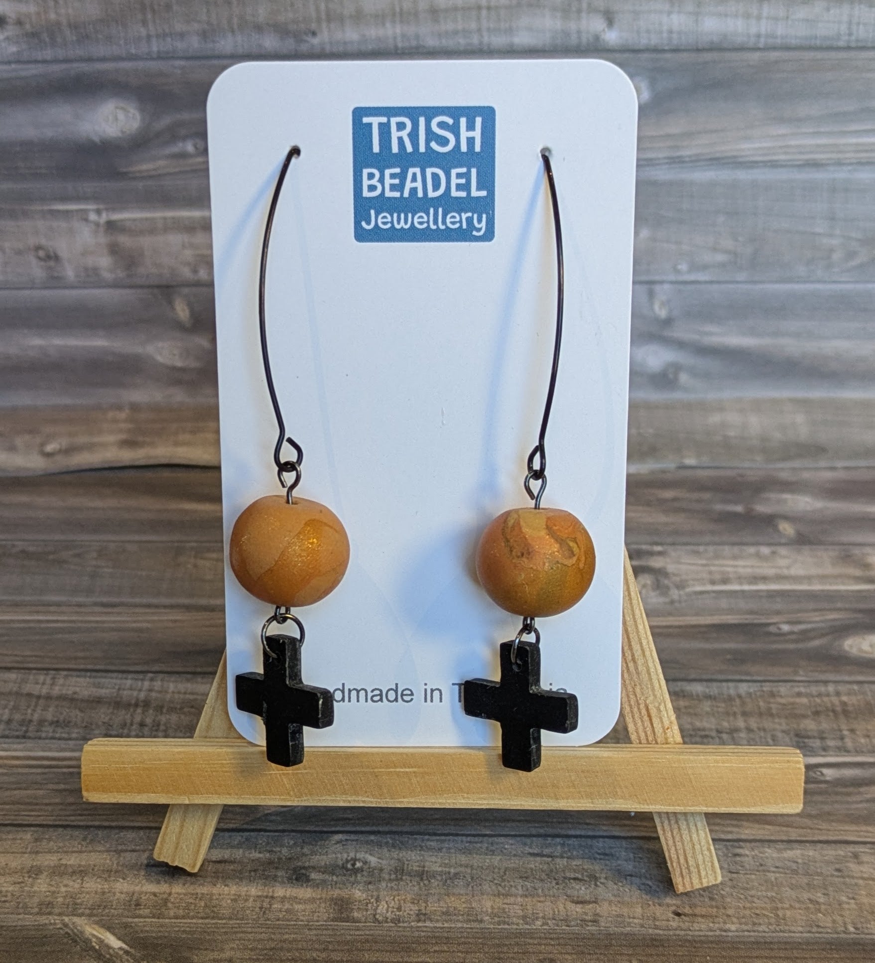 Black cross drop ball earrings