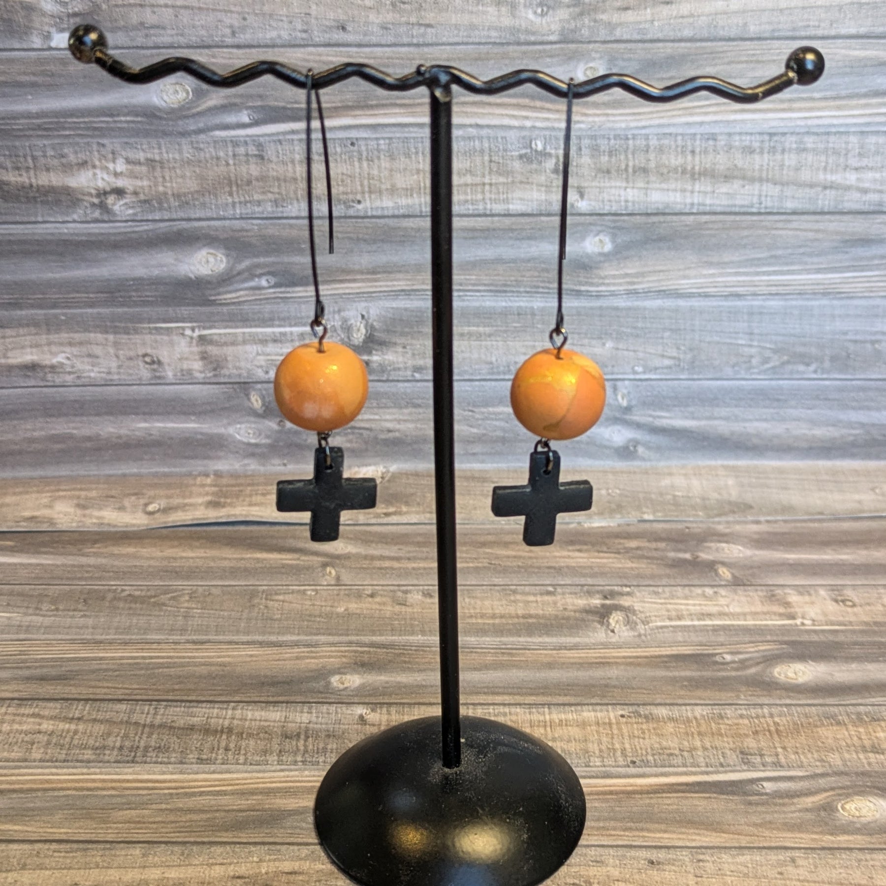 Black cross drop ball earrings