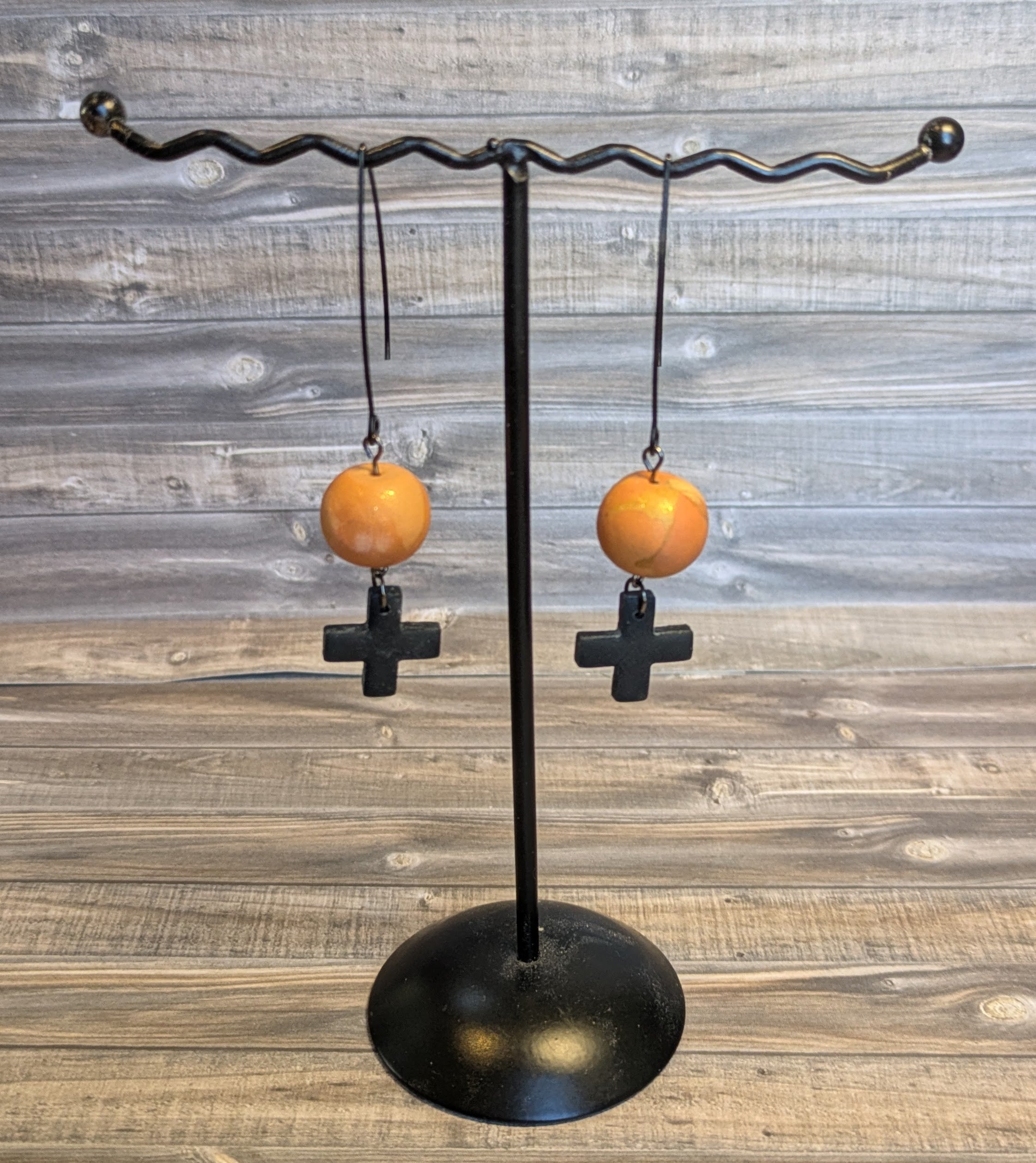 Black cross drop ball earrings