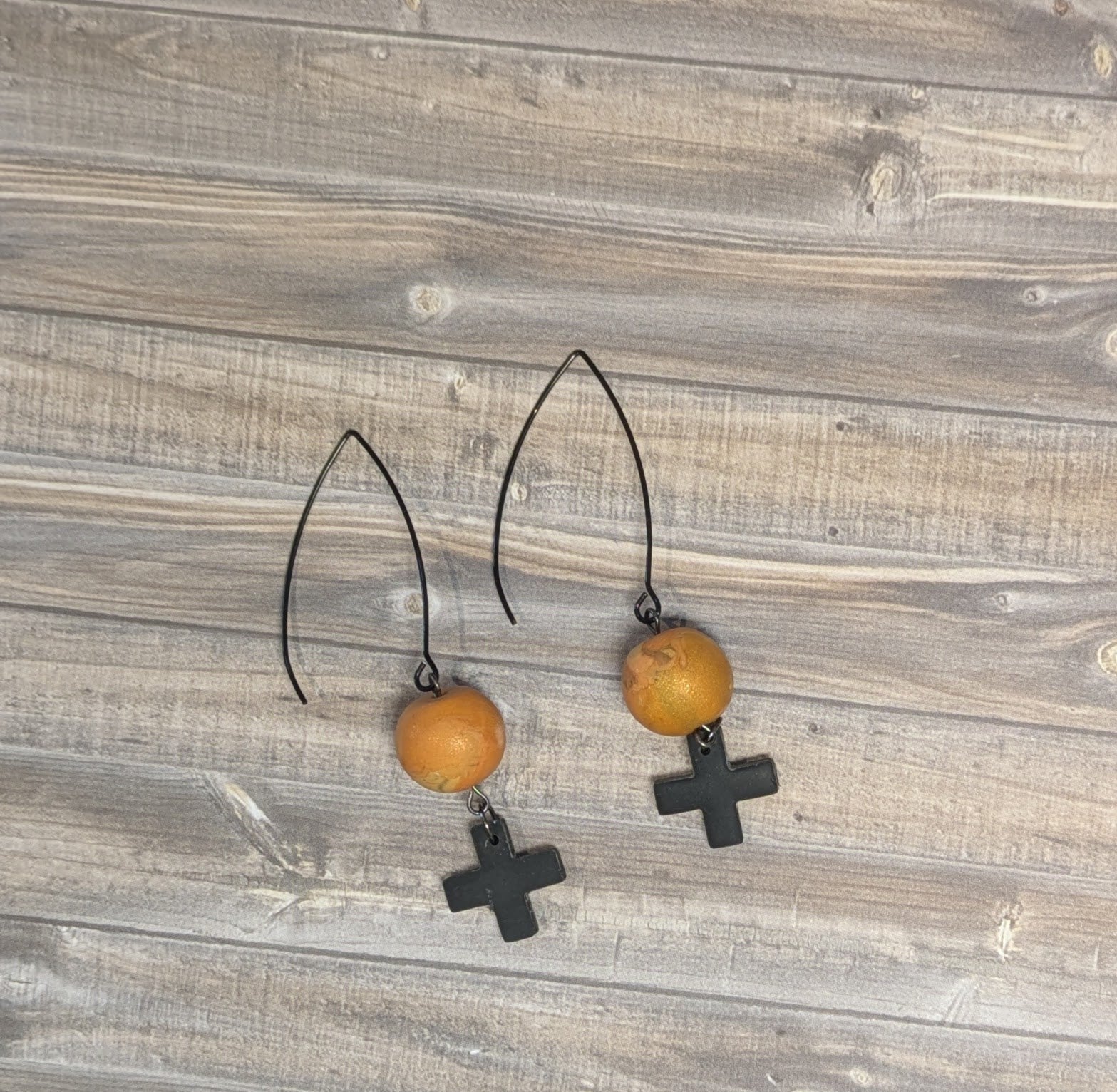 Black cross drop ball earrings