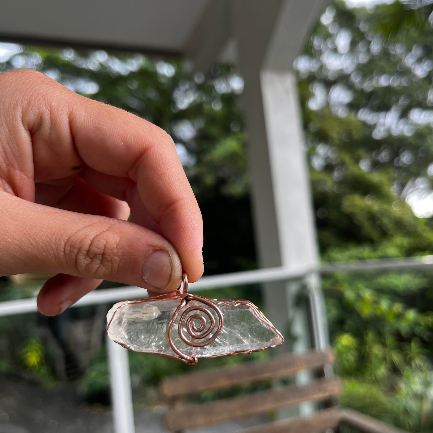 Clear quartz swirl pendant