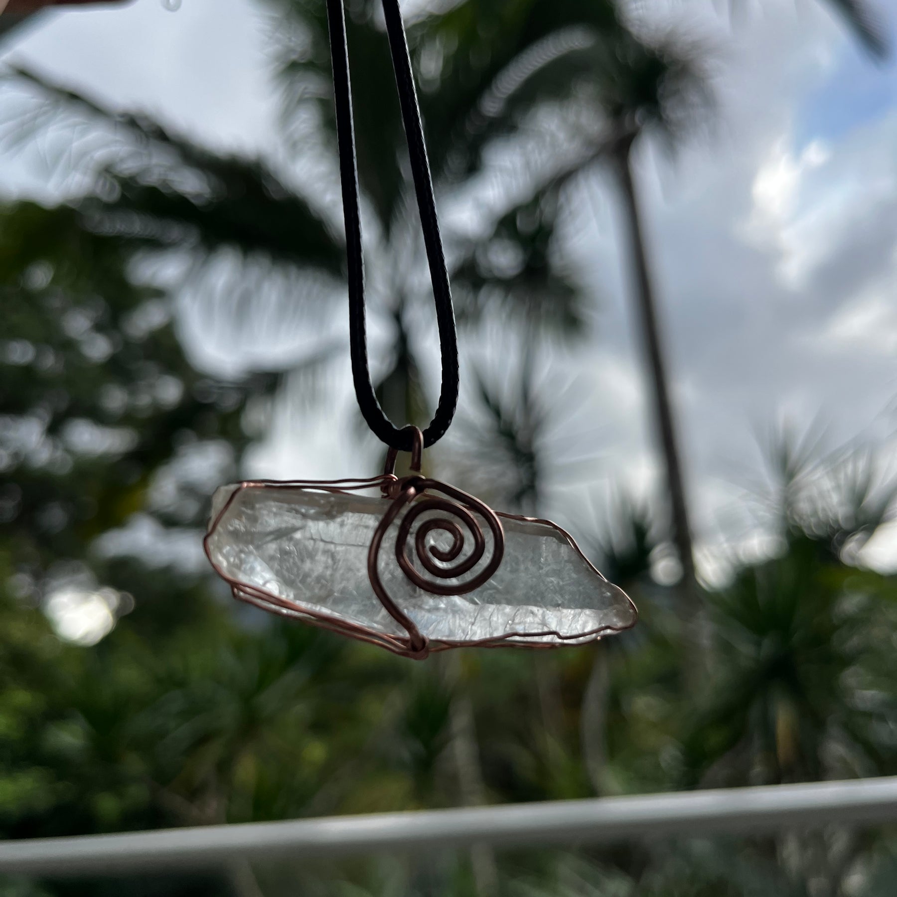 Clear quartz swirl pendant