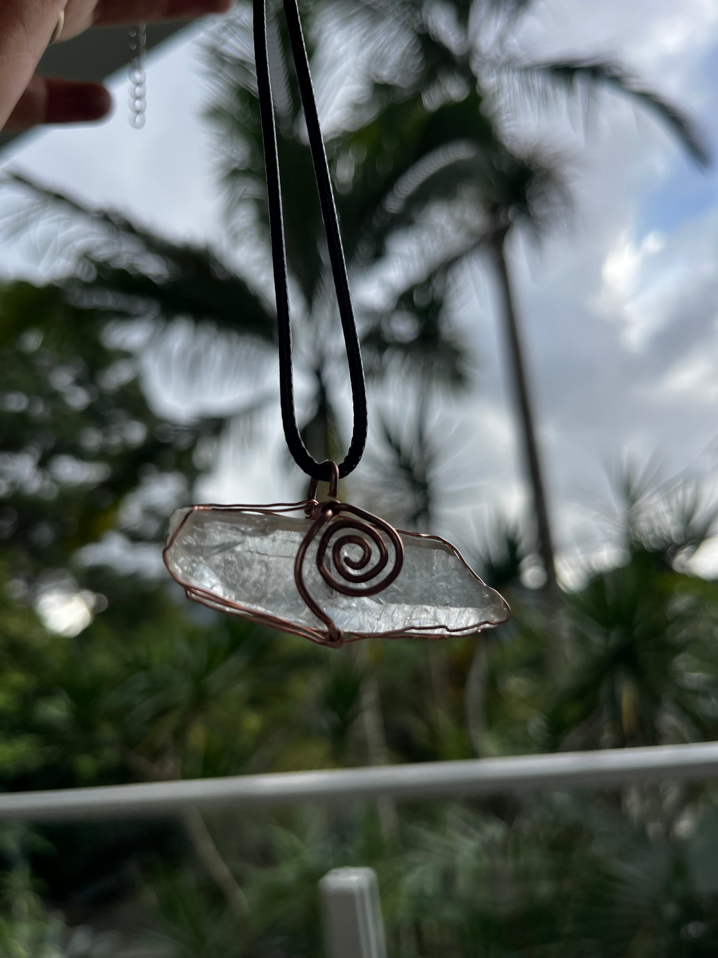 Clear quartz swirl pendant