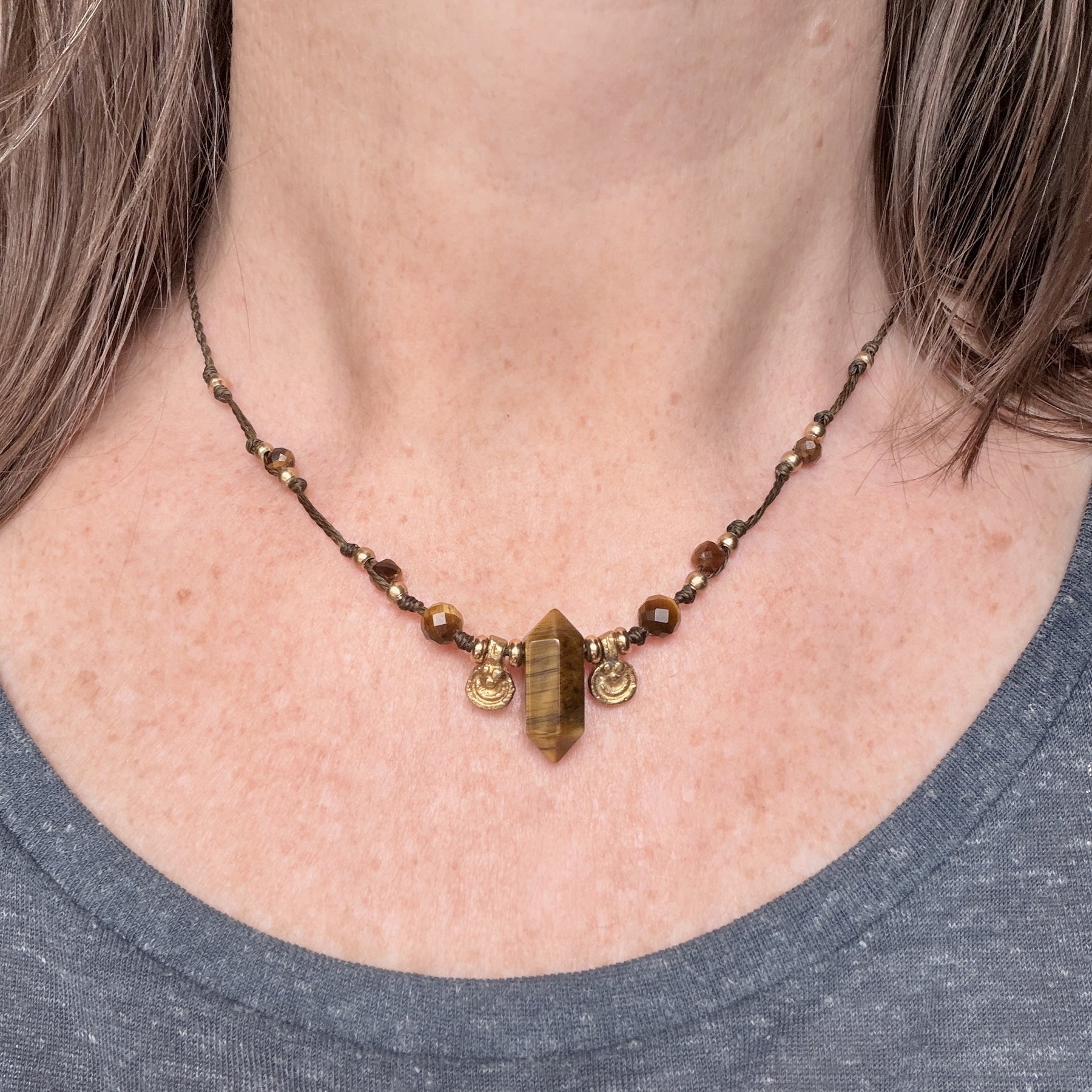 Crystal point necklace with faceted beads and solid brass charm