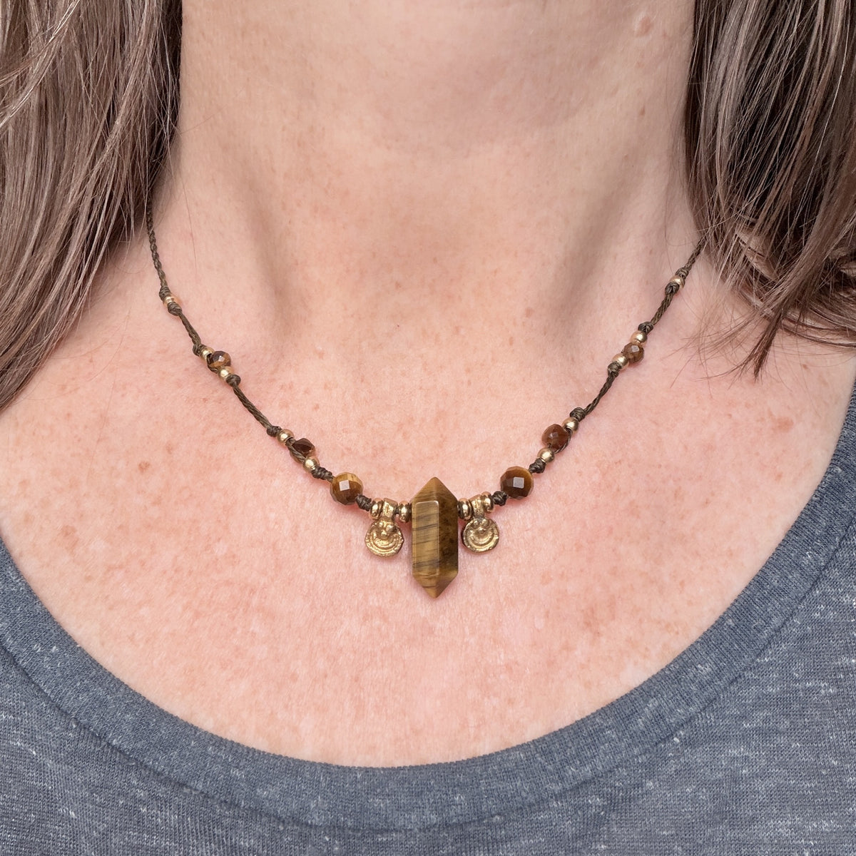 Crystal point necklace with faceted beads and solid brass charm