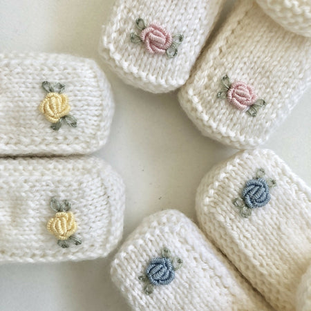 Hand-knitted baby booties with hand-embroidered rosebuds (Australian merino wool)