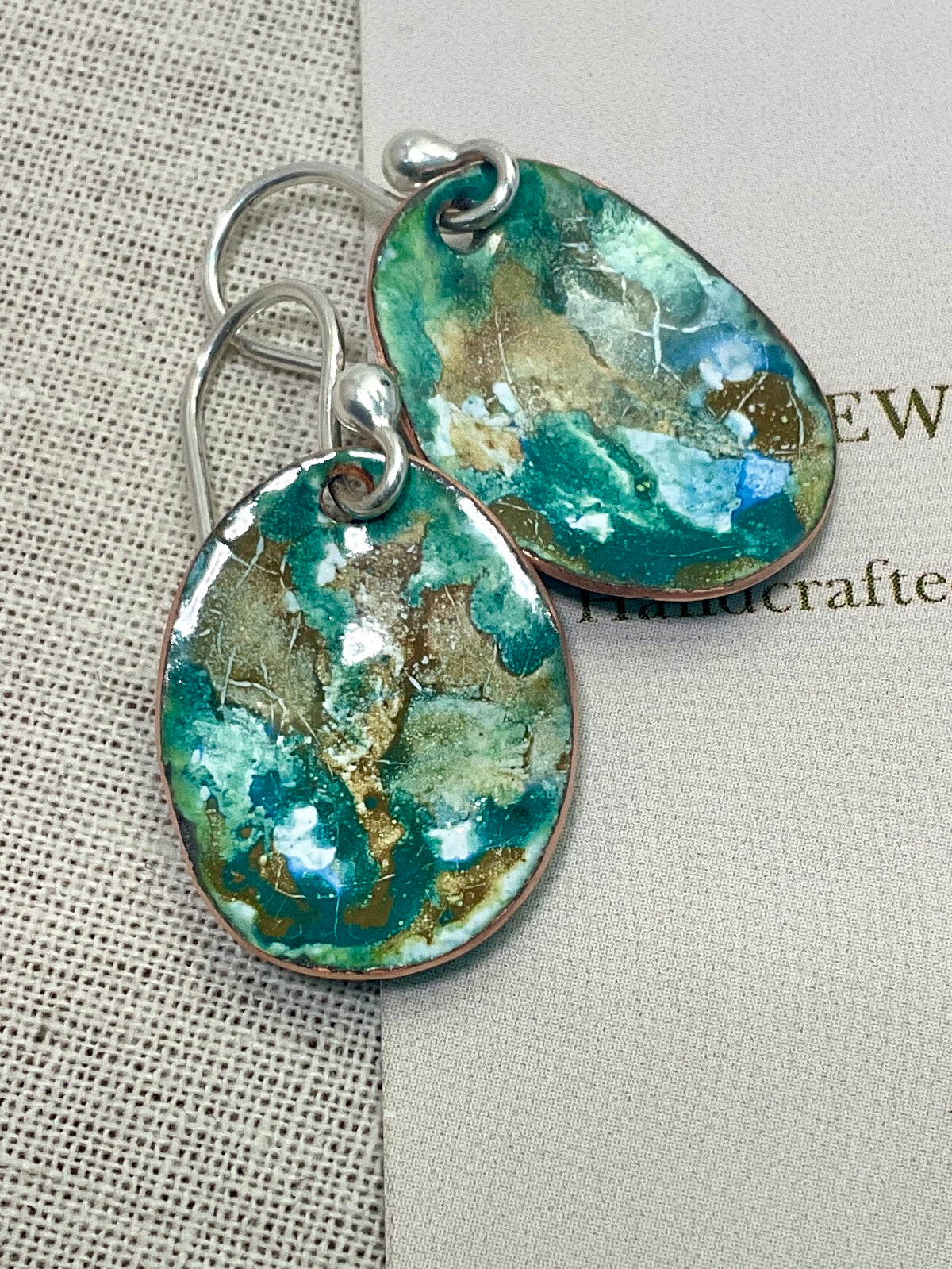 Blue and earthy brown oval abstract enamel earrings. Handmade