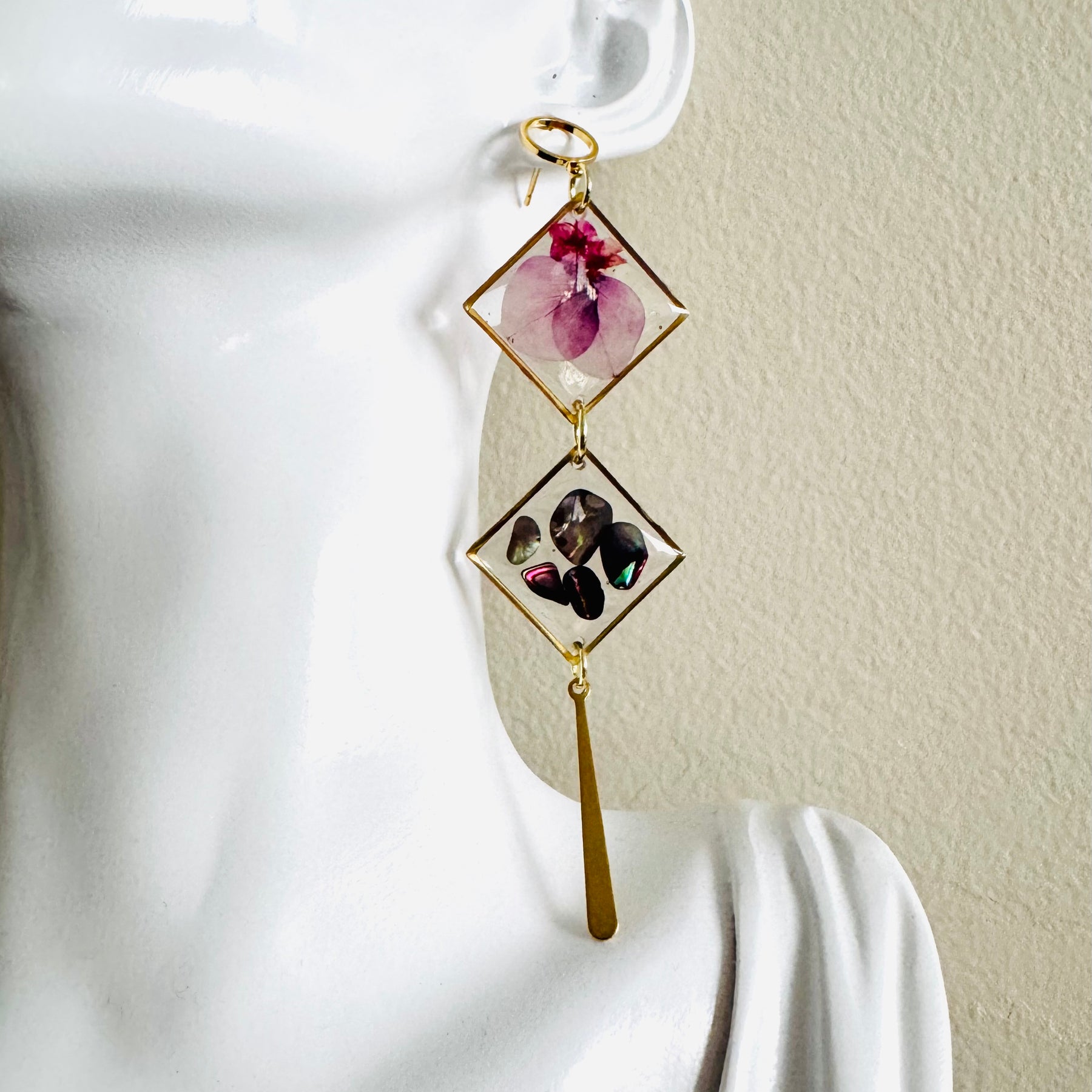 Double rhombus cowrie shell and pressed flower resin earrings