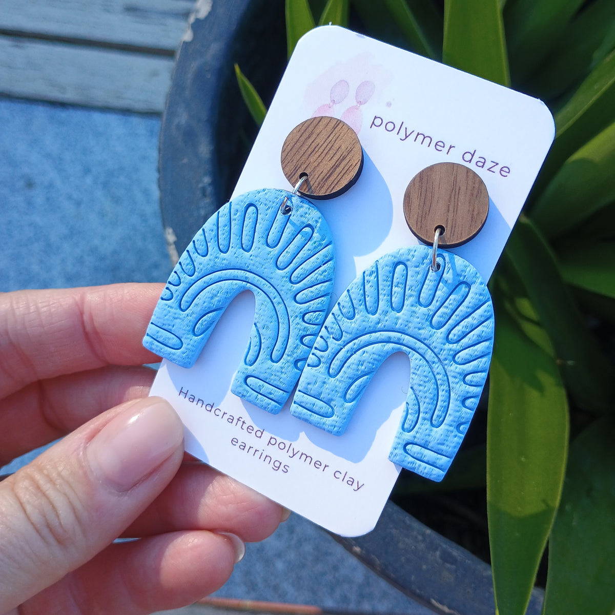 Embossed blue arch earrings with natural wood stud top