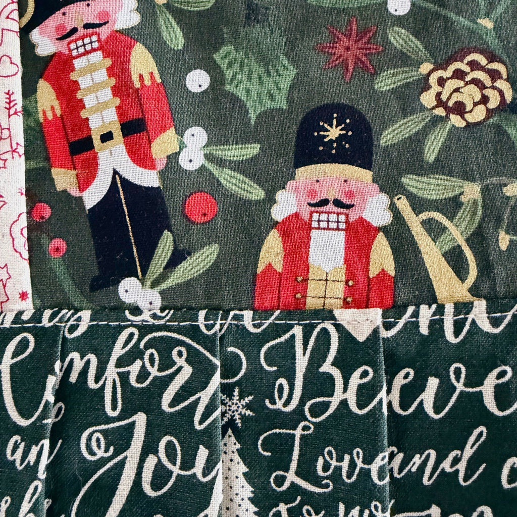 Nutcrackers ladies' Christmas tie back apron.