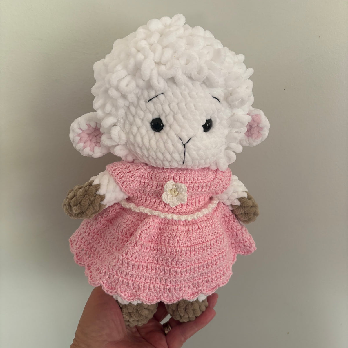 Crochet lamb in a pink dress