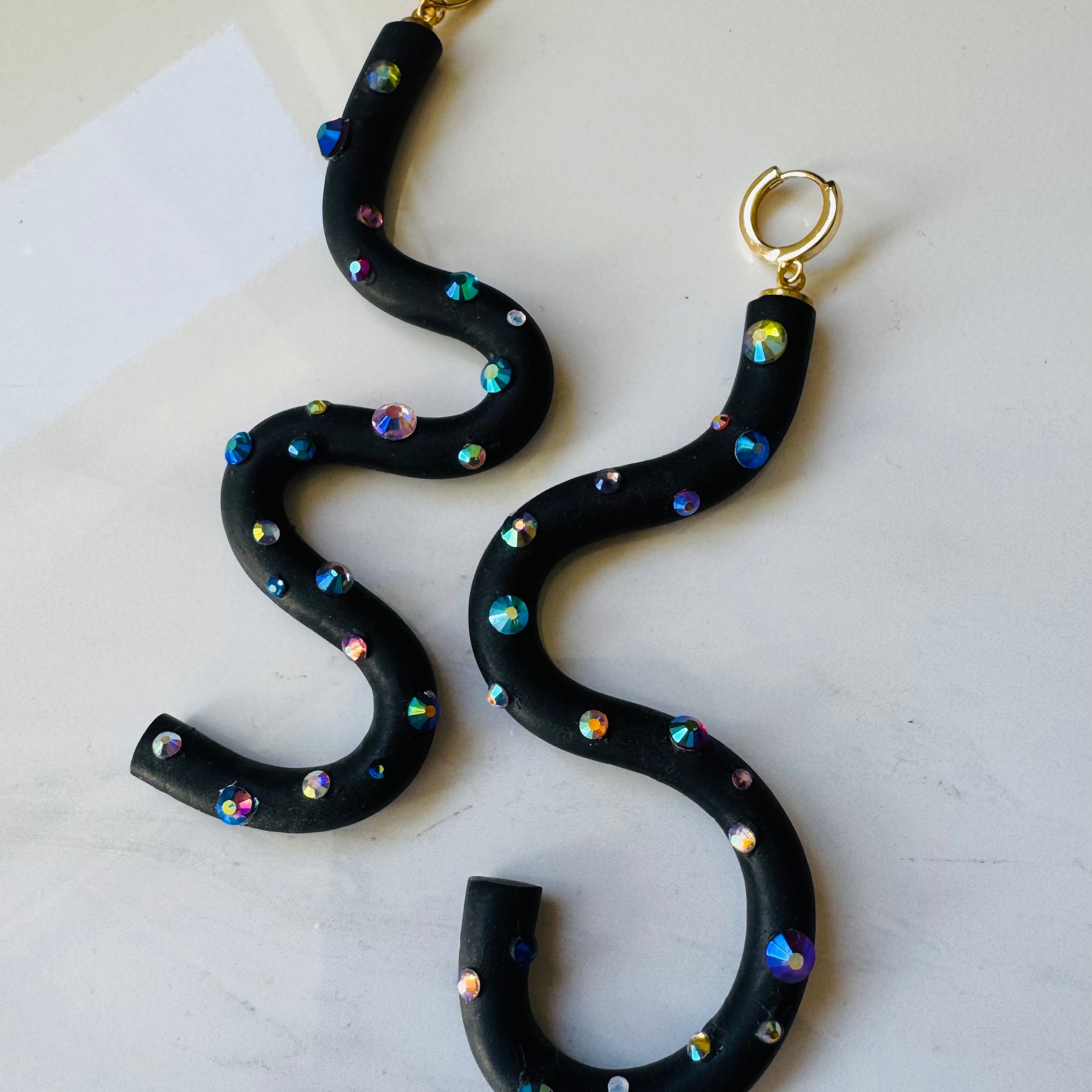 Black squiggle polymer clay earrings with holographic gems