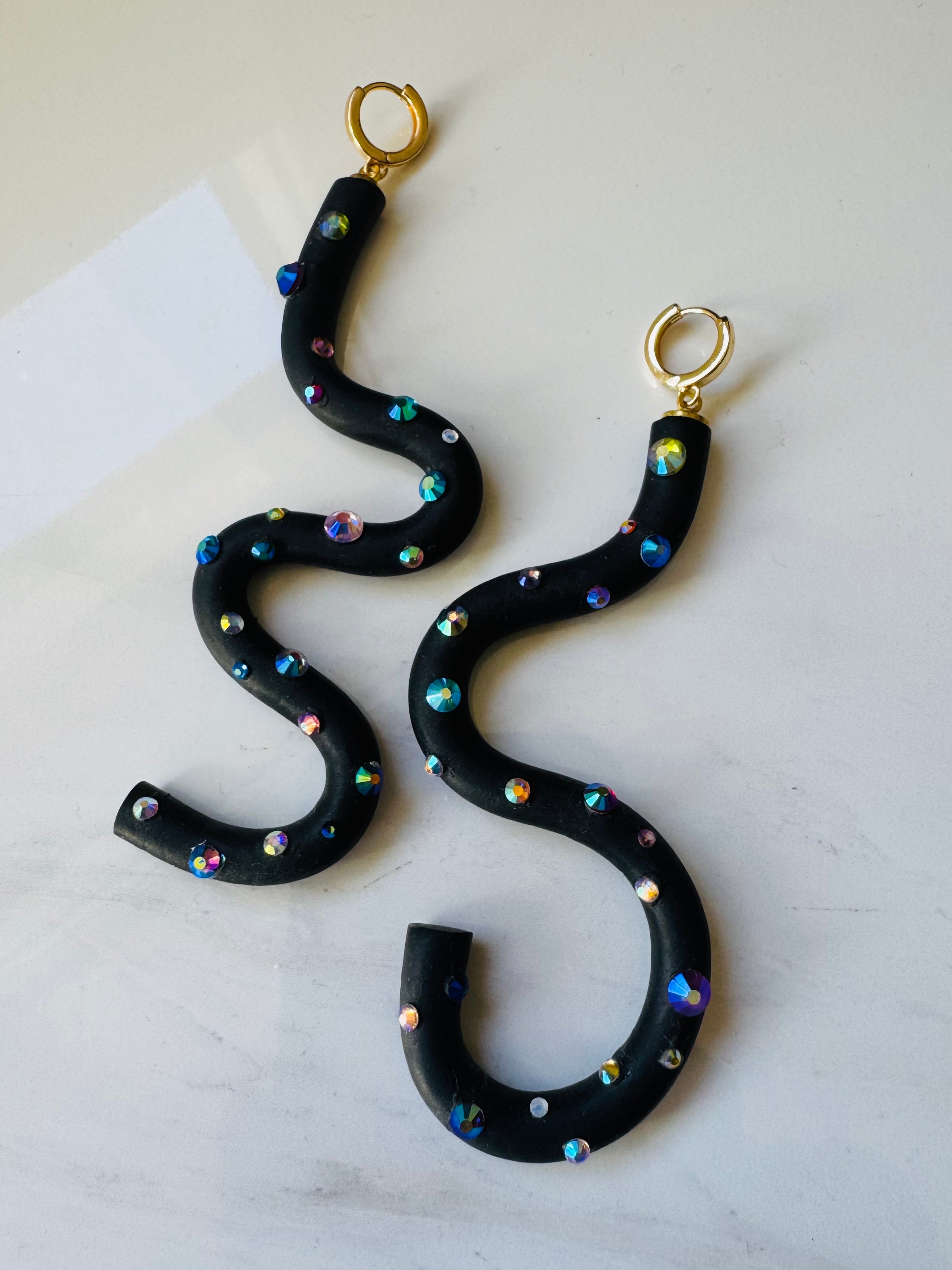 Black squiggle polymer clay earrings with holographic gems