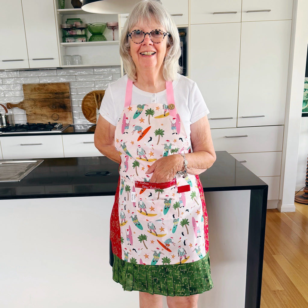 Surfing Santas. Ladies' Christmas tie back apron.