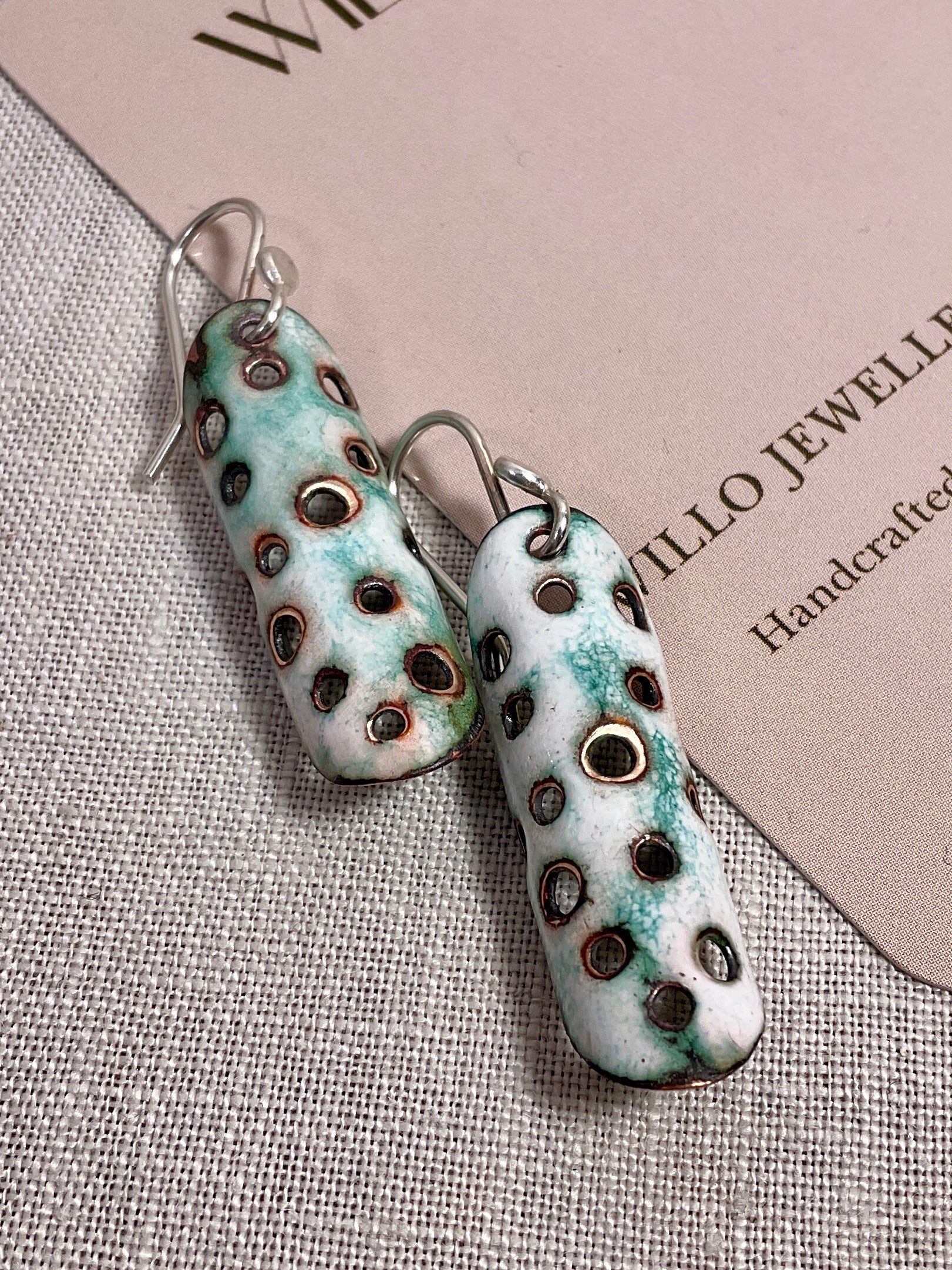 White and teal enamel earrings. Handmade