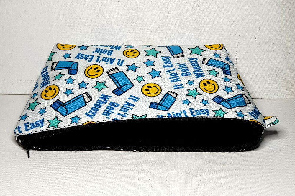 Asthma Puffer Pouch, size XL, White with Blue Inhalers, the phrase It Ain't Easy Bein" Wheezy, and yellow happy faces