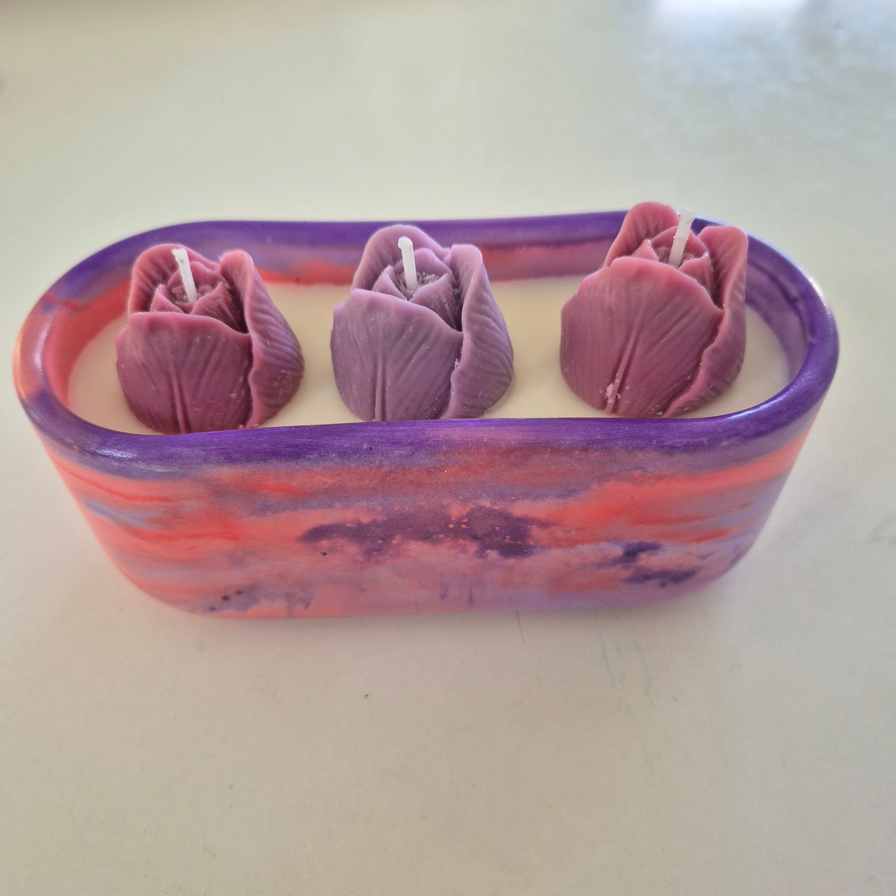 Red and purple oval concrete tulip bowl candle with sandalwood