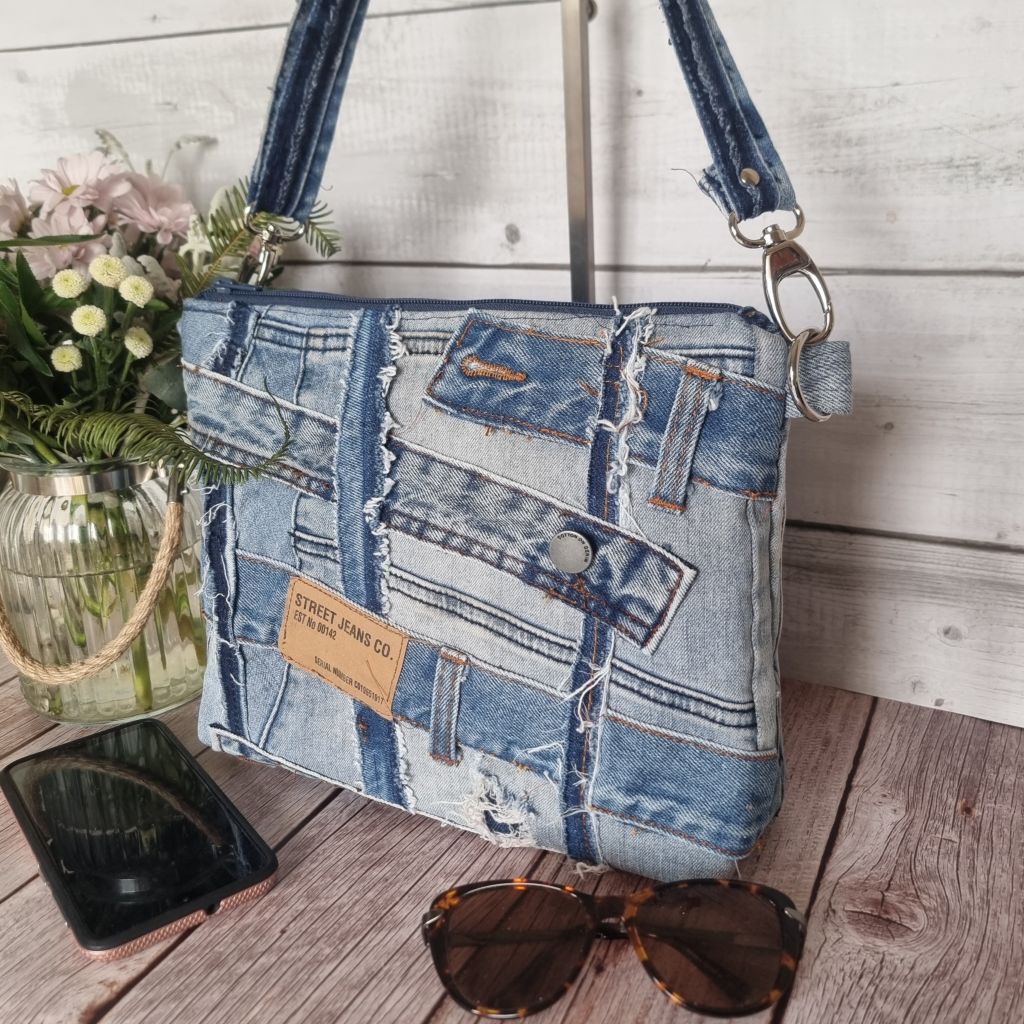 Handmade upcycled angle patched denim zip crossbody bag