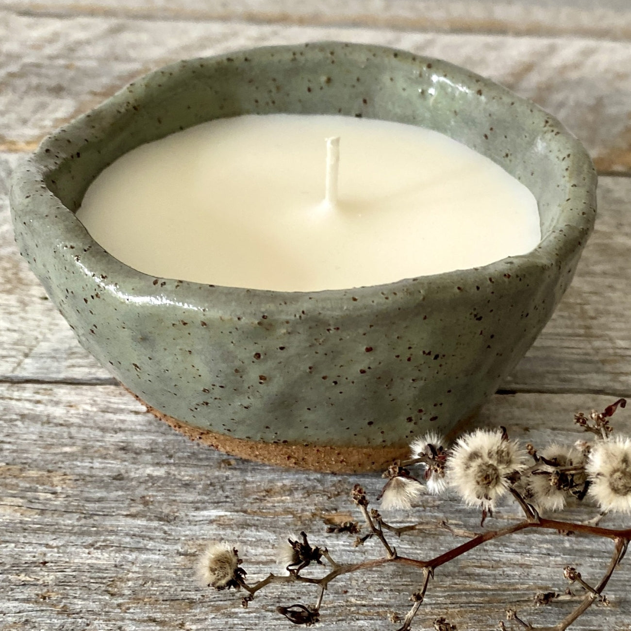 Soy candle in rustic sage green speckled ceramic bowl