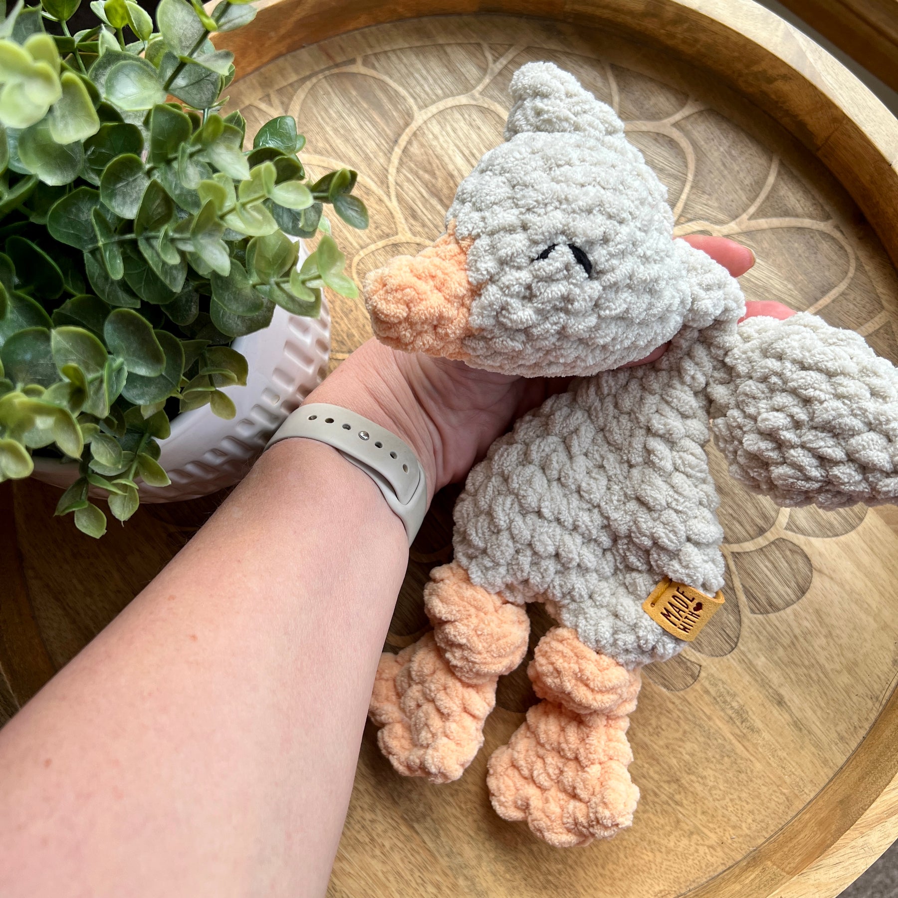 Handmade crochet Mini Goose modern lovey with knotted legs.
